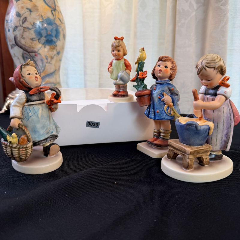 Four Hummel figurines, the largest is 5", S0030