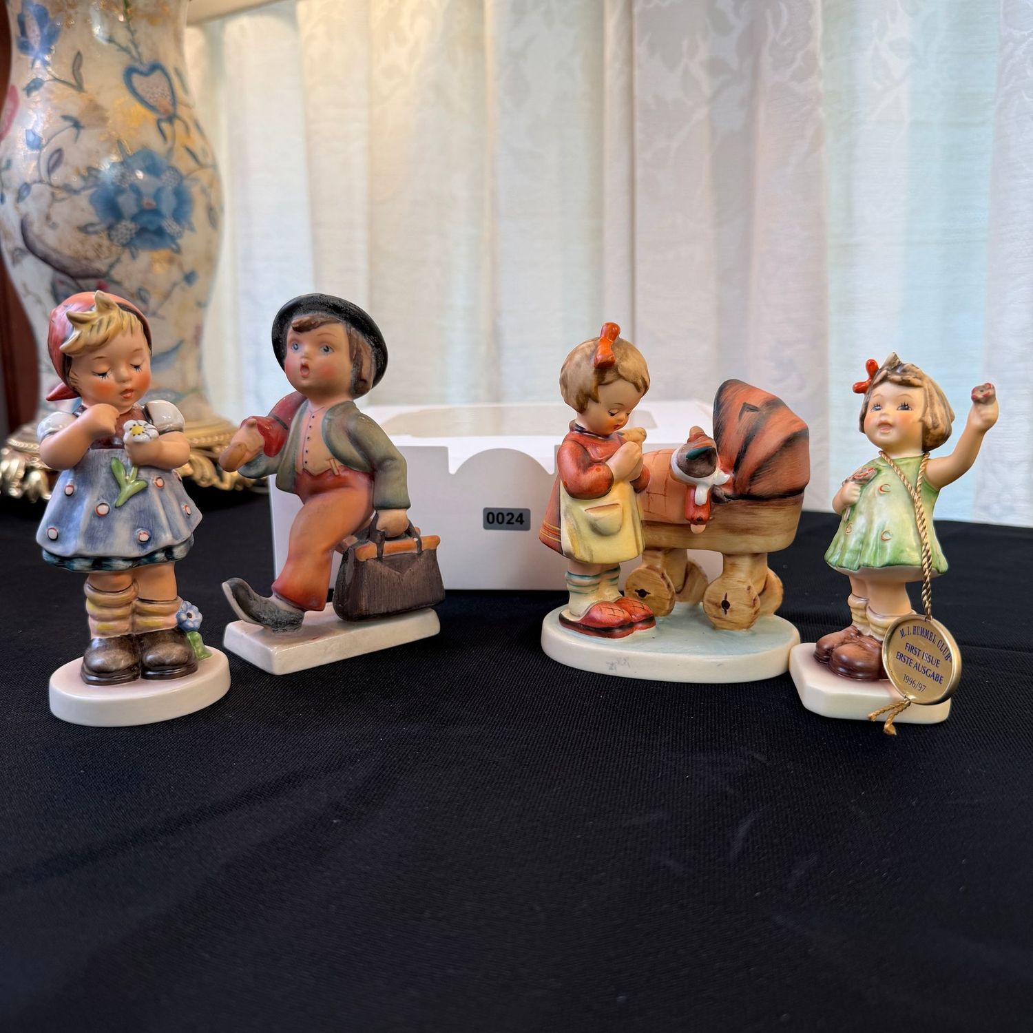 Four Hummel figurines, the largest is 5 Four Hummel figurines, the largest is 5", S0024