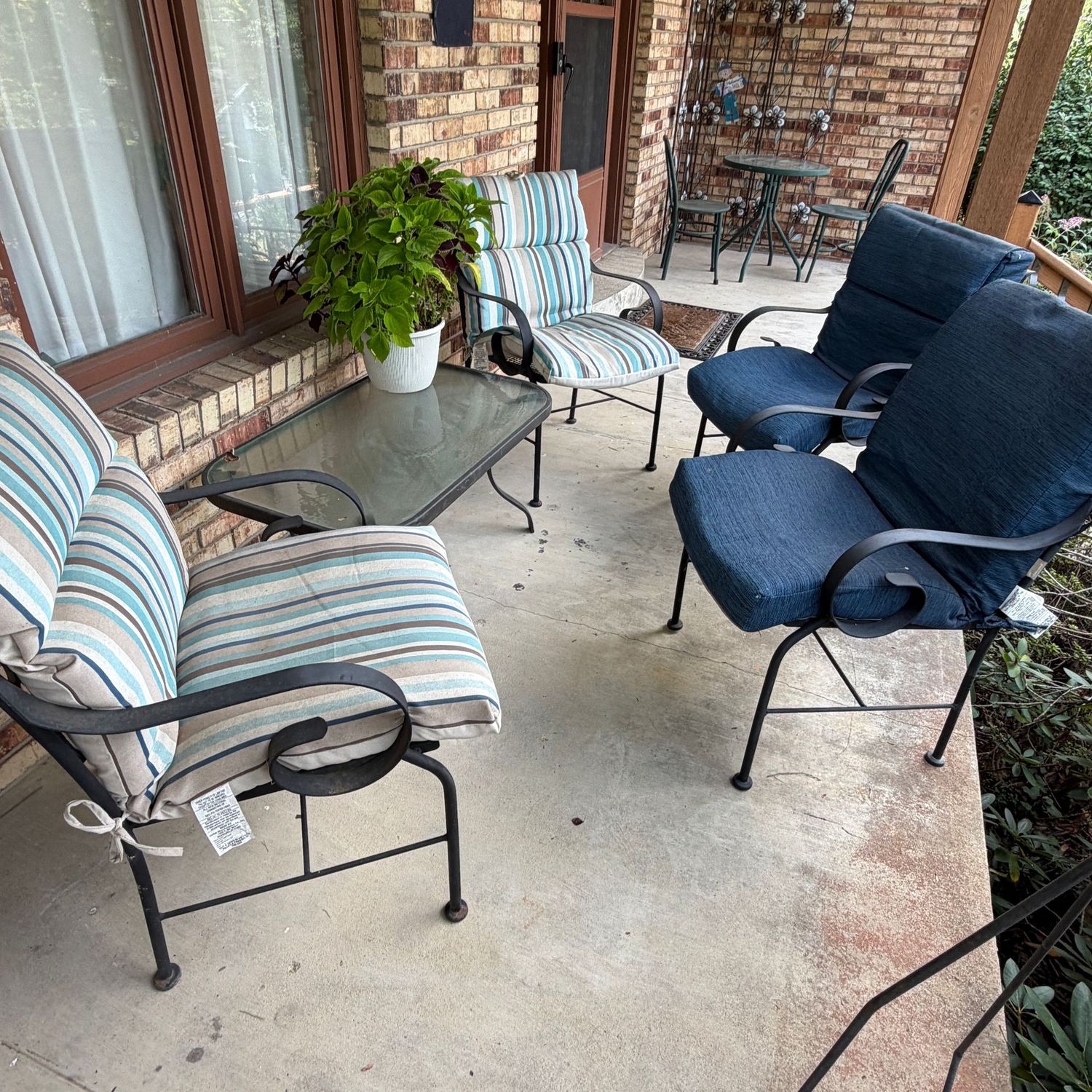 Patio chairs (34"H x 22"W) and coffee table (36" x 22"), mild oxidation, overall in good condition