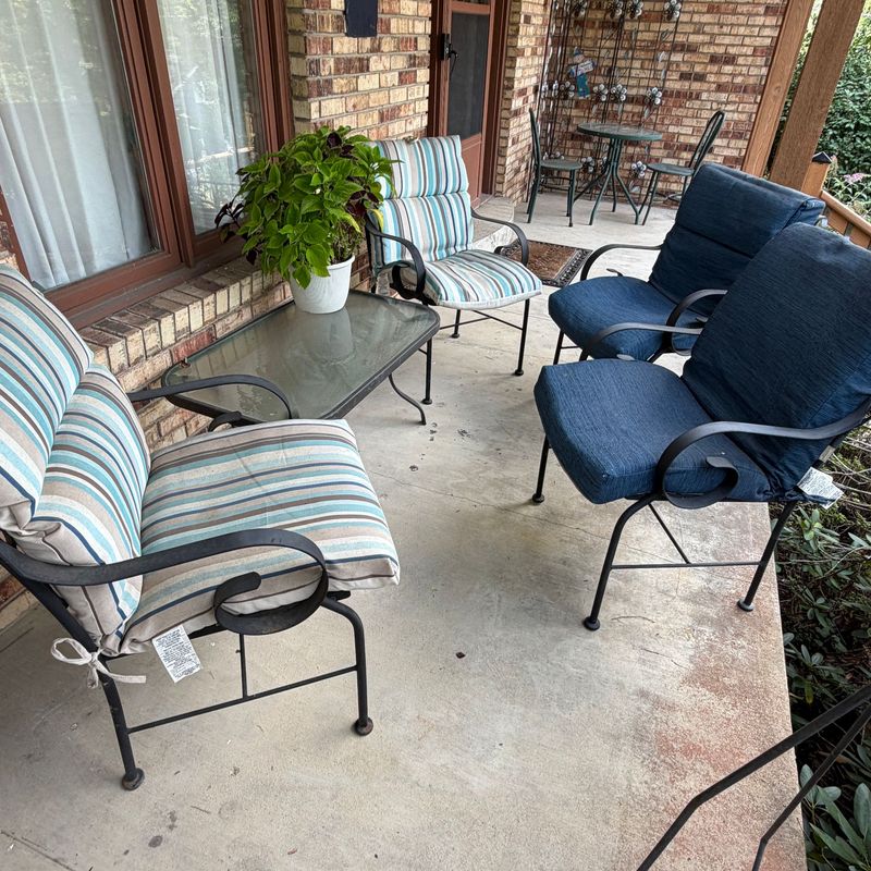 Patio chairs (34"H x 22"W) and coffee table (36" x 22"), mild oxidation, overall in good condition