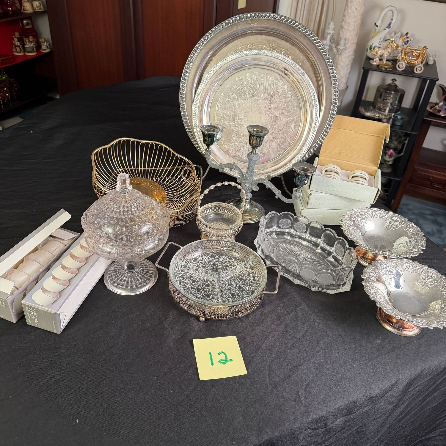 Box Lot (wrapped) #12, silver-plated trays, coin glass, napkin rings, baskets Box Lot (wrapped) #12, silver-plated trays, coin glass, napkin rings, baskets