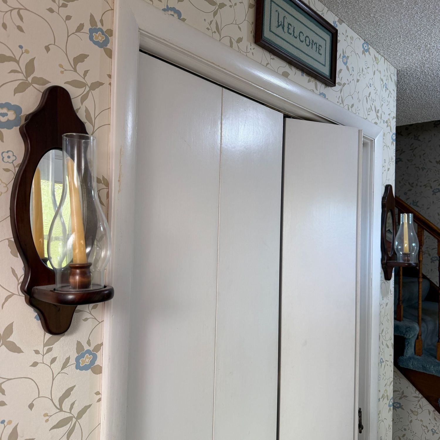 Pair of wooden candlestick sconces with mirrored back, 17"H