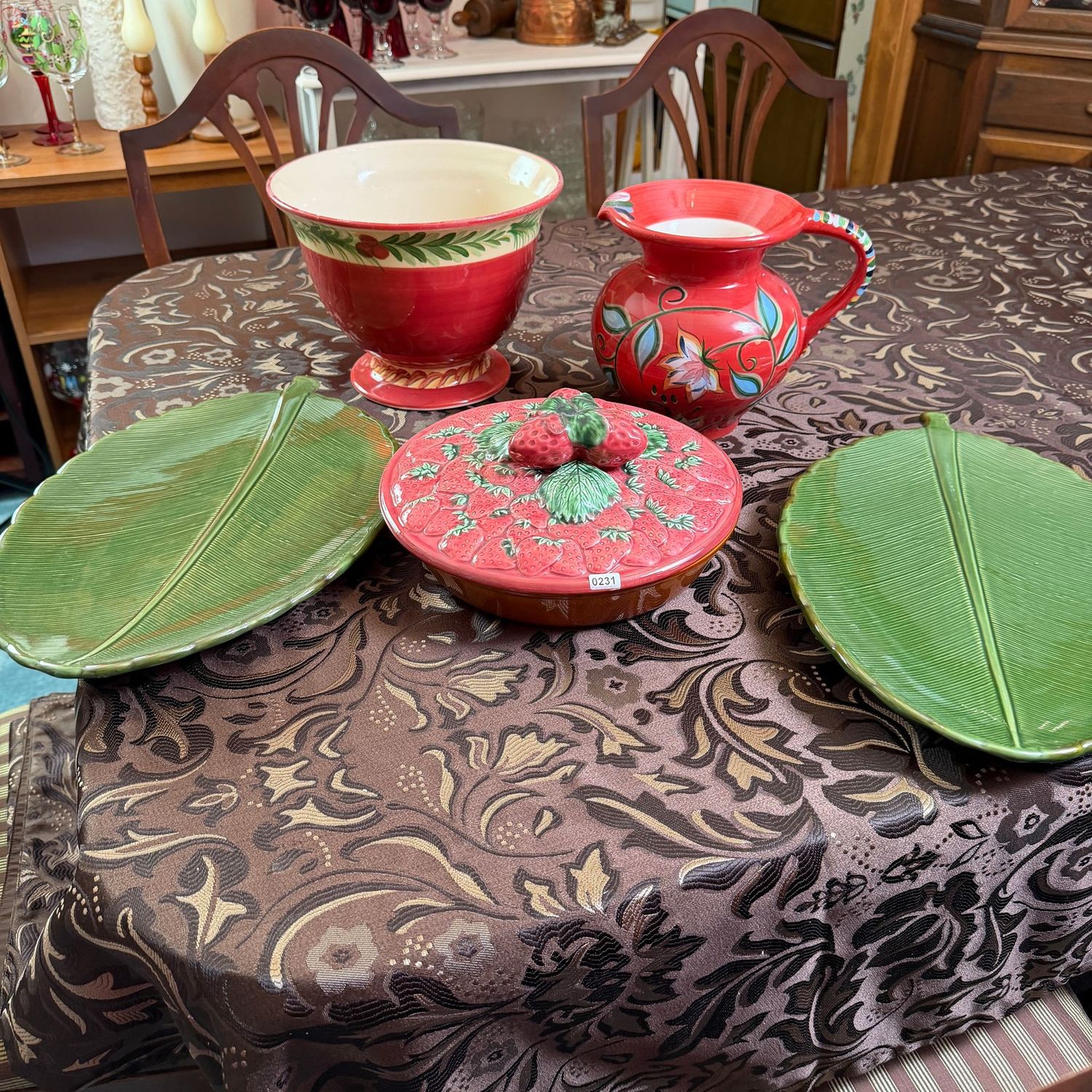Group of ceramic covered pie, footed bowl, pitcher, and two 16 Group of ceramic covered pie, footed bowl, pitcher, and two 16"L leaf platters, S0231