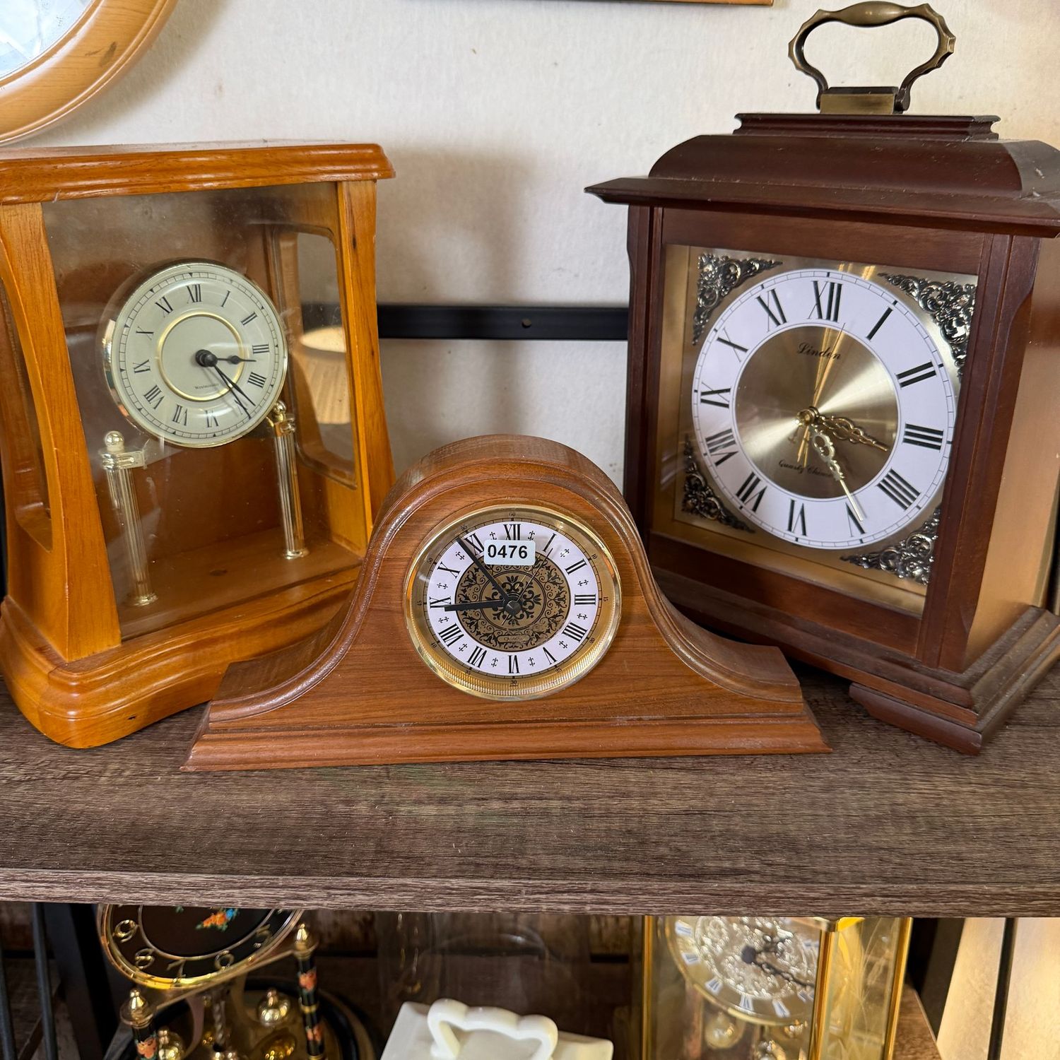 Group of 3 wooden battery-operated clocks, all working, the Linden chimes, and is 10 Group of 3 wooden battery-operated clocks, all working, the Linden chimes, and is 10"H x 9"W, S0476