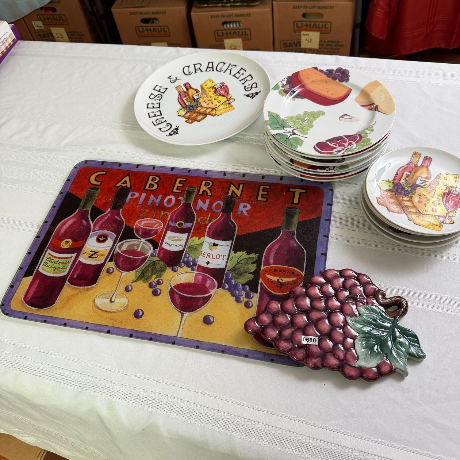 Cabernet serving pieces with plates, ceramic grapes trivet, and 17 Cabernet serving pieces with plates, ceramic grapes trivet, and 17"L glass cutting board, S0680