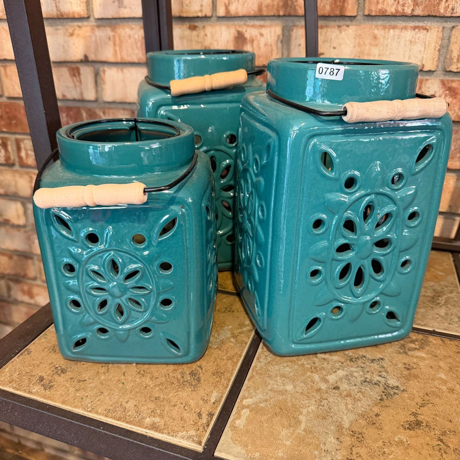 Trio of teal green ceramic luminaries with handles, the tallest is 9"H, S0787
