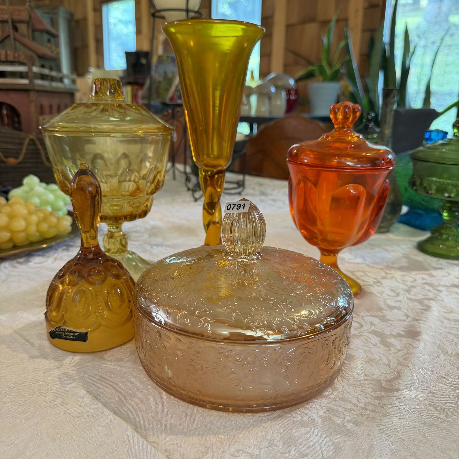Grouping of amber, iridescent, and tangering glass bell, compotes, and 10"H chalice vase, S0791