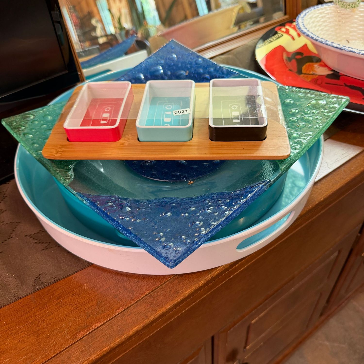 Blue serving pieces with square glass dish, nut server, and two round plastic trays, the largest is 15 Blue serving pieces with square glass dish, nut server, and two round plastic trays, the largest is 15"W, S0831