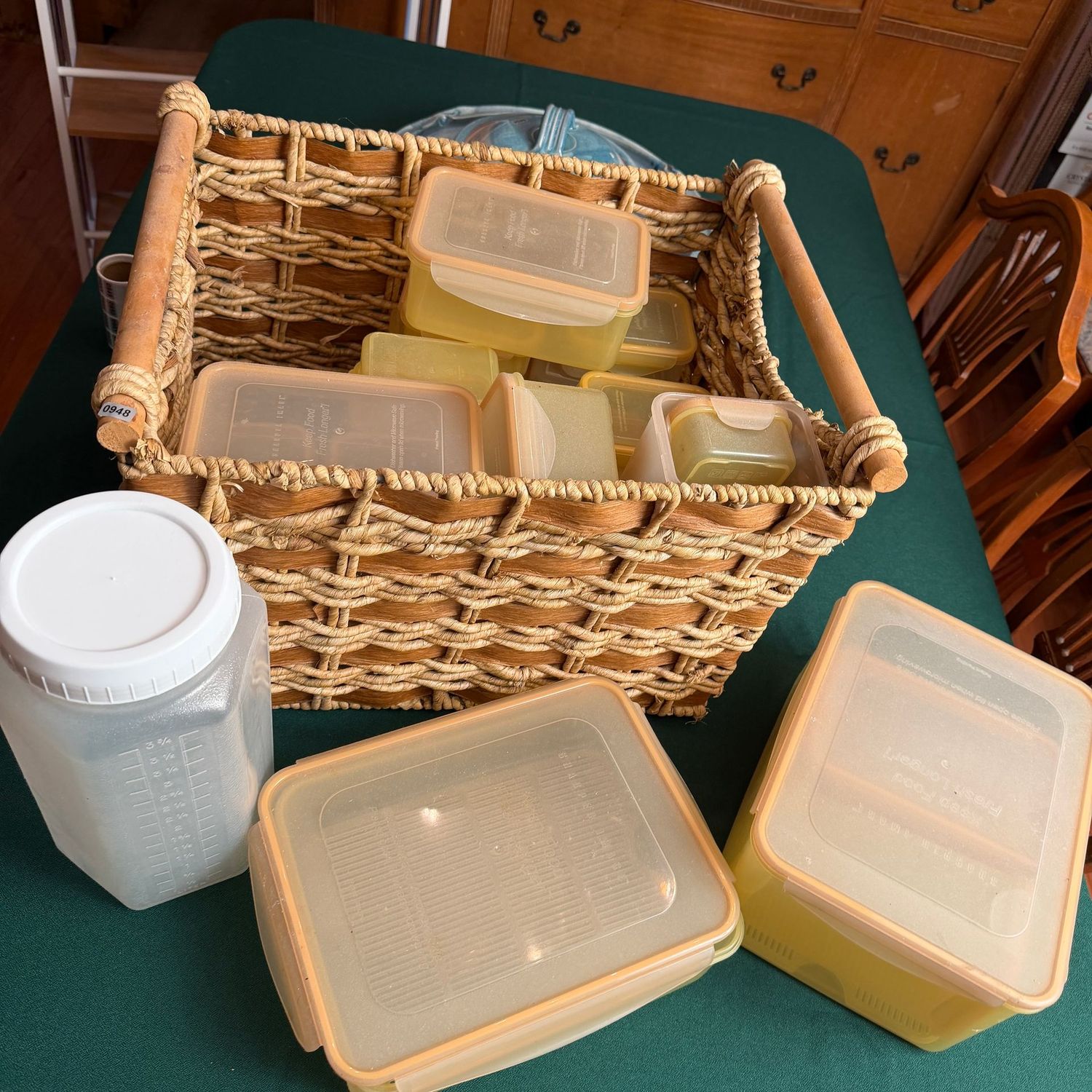 Large woven basket with plastic containers, some wear S0948 Large woven basket with plastic containers, some wear S0948