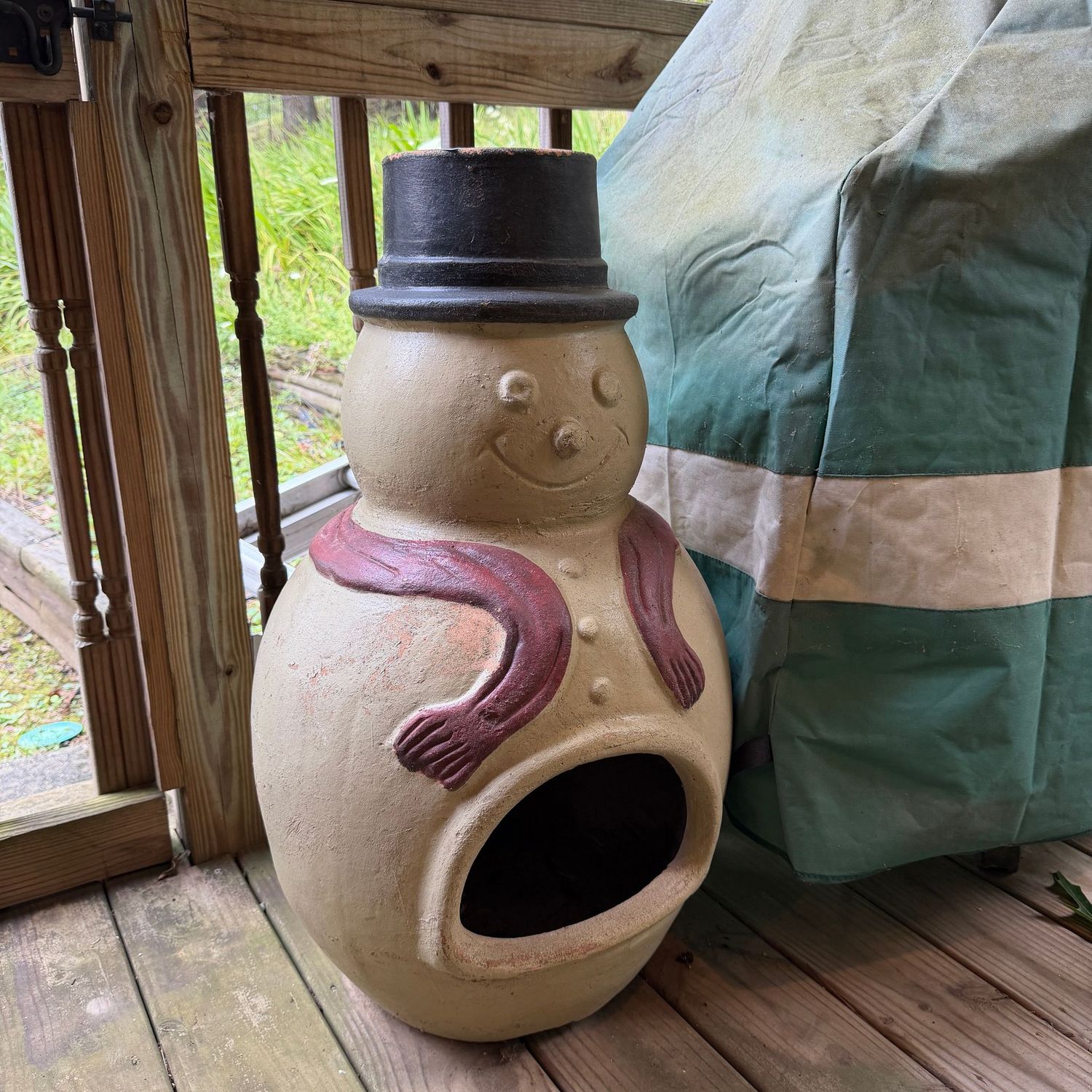 Terracotta snowman chiminea, appears to be in good condition, minor wear of paint in some spots, some wear to base around edges, heavy, 28 Terracotta snowman chiminea, appears to be in good condition, minor wear of paint in some spots, some wear to base around edges, heavy, 28"H x 18"W, S0926