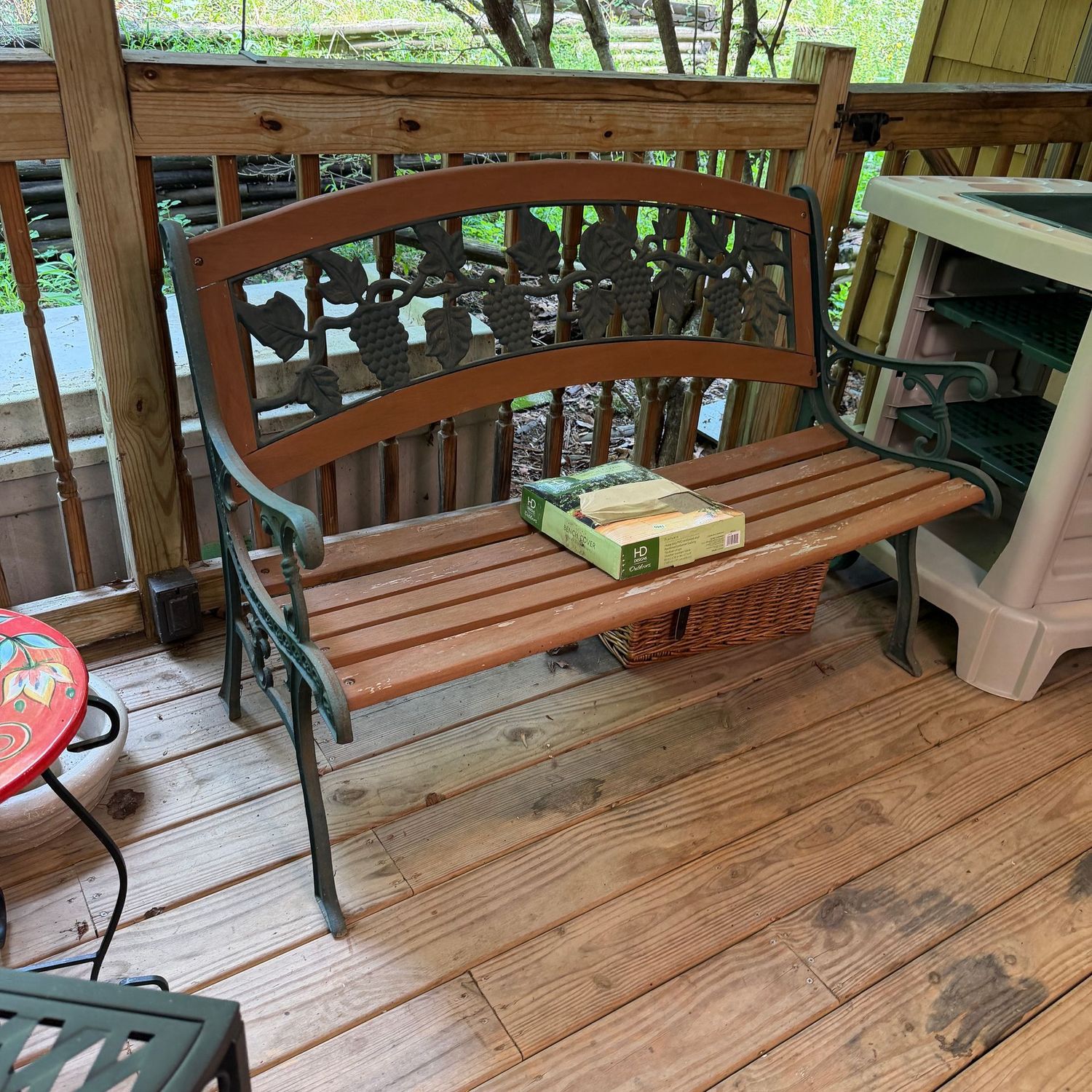 Green cast metal patio bench with grapes pattern, wood slat seat, some wear to finish, comes with a cover, heavy, 26 Green cast metal patio bench with grapes pattern, wood slat seat, some wear to finish, comes with a cover, heavy, 26"H x 27"D x 50"L, S0941