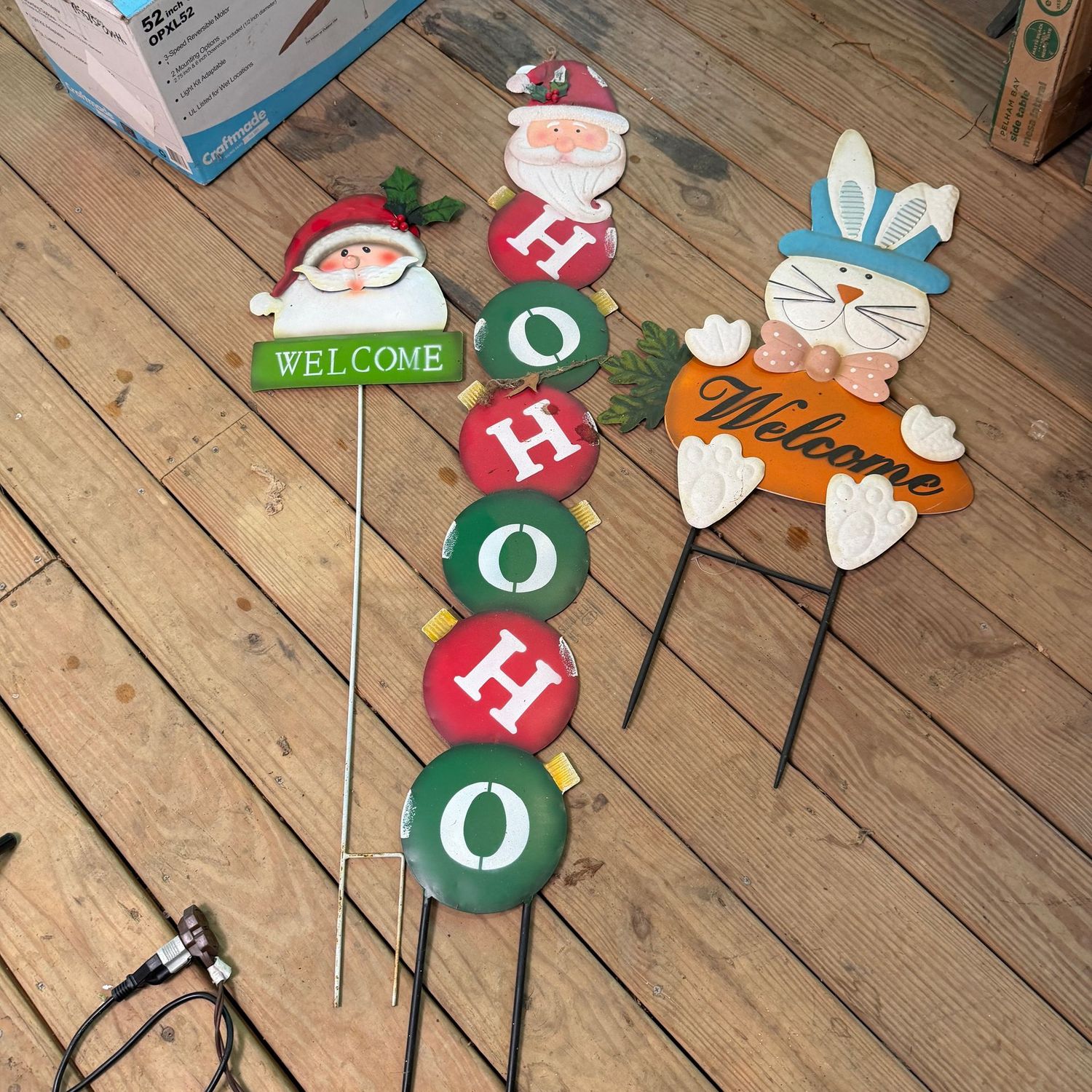 Group of Christmas and Easter metal yard signs, the tallest is 46"L