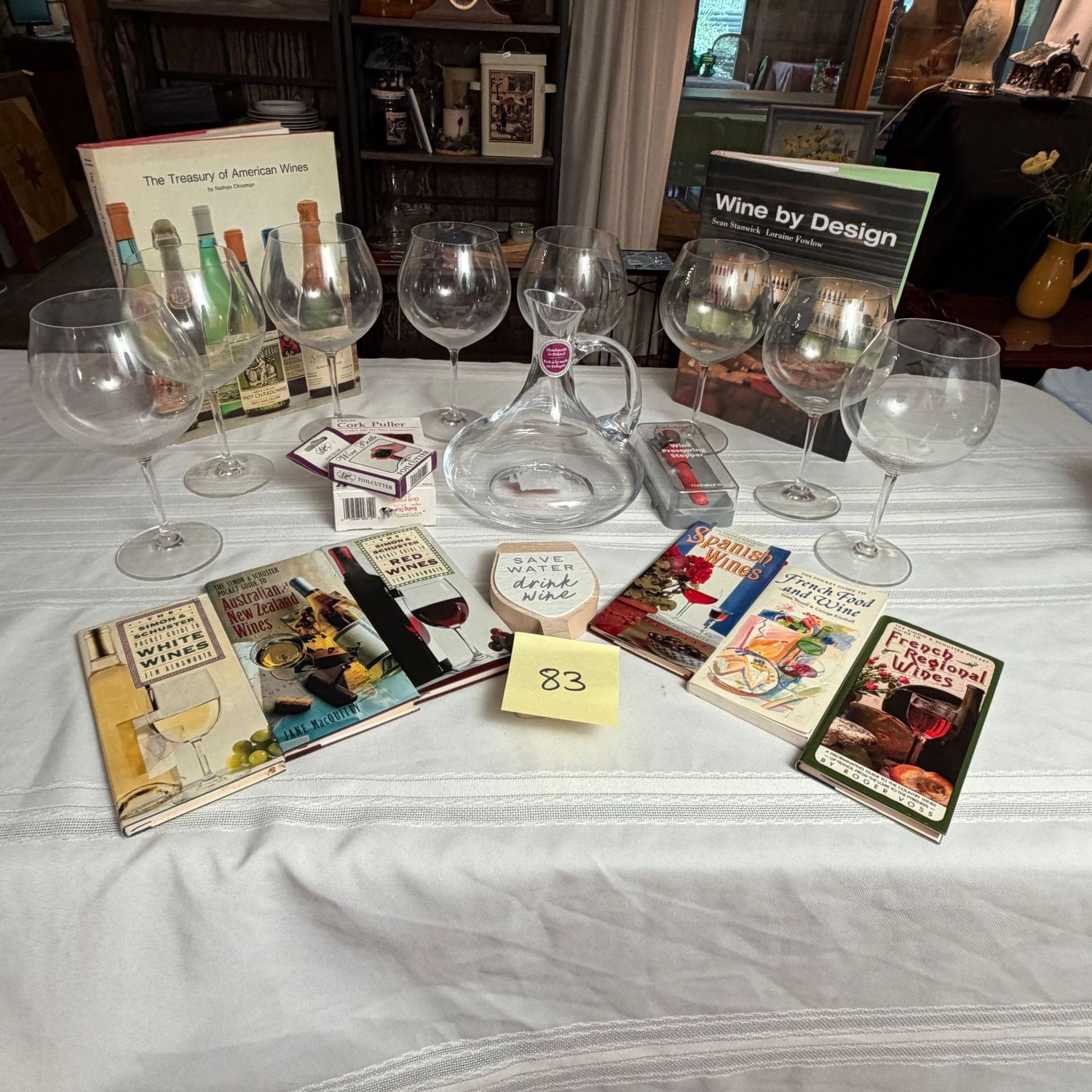 Box Lot (Wrapped) 83, Save Water Drink Wine lot with fine crystal stemware, wine books, guides, crystal decanter, and more Box Lot (Wrapped) 83, Save Water Drink Wine lot with fine crystal stemware, wine books, guides, crystal decanter, and more