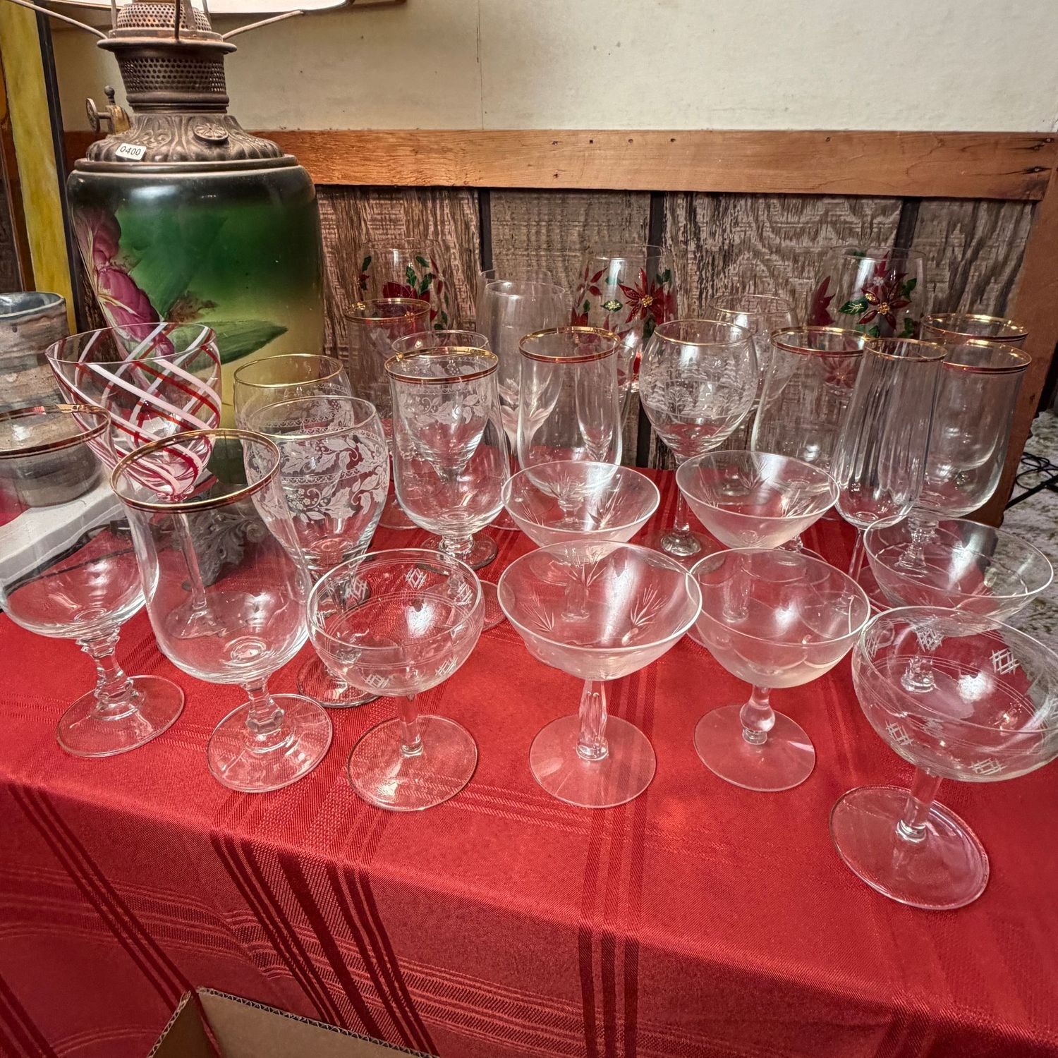 Box Lot (Wrapped) 84, Spruce up the holiday with a variety of cocktail/champagne glasses, gold-rimmed stemware, and poinsettia stemware Box Lot (Wrapped) 84, Spruce up the holiday with a variety of cocktail/champagne glasses, gold-rimmed stemware, and poinsettia stemware