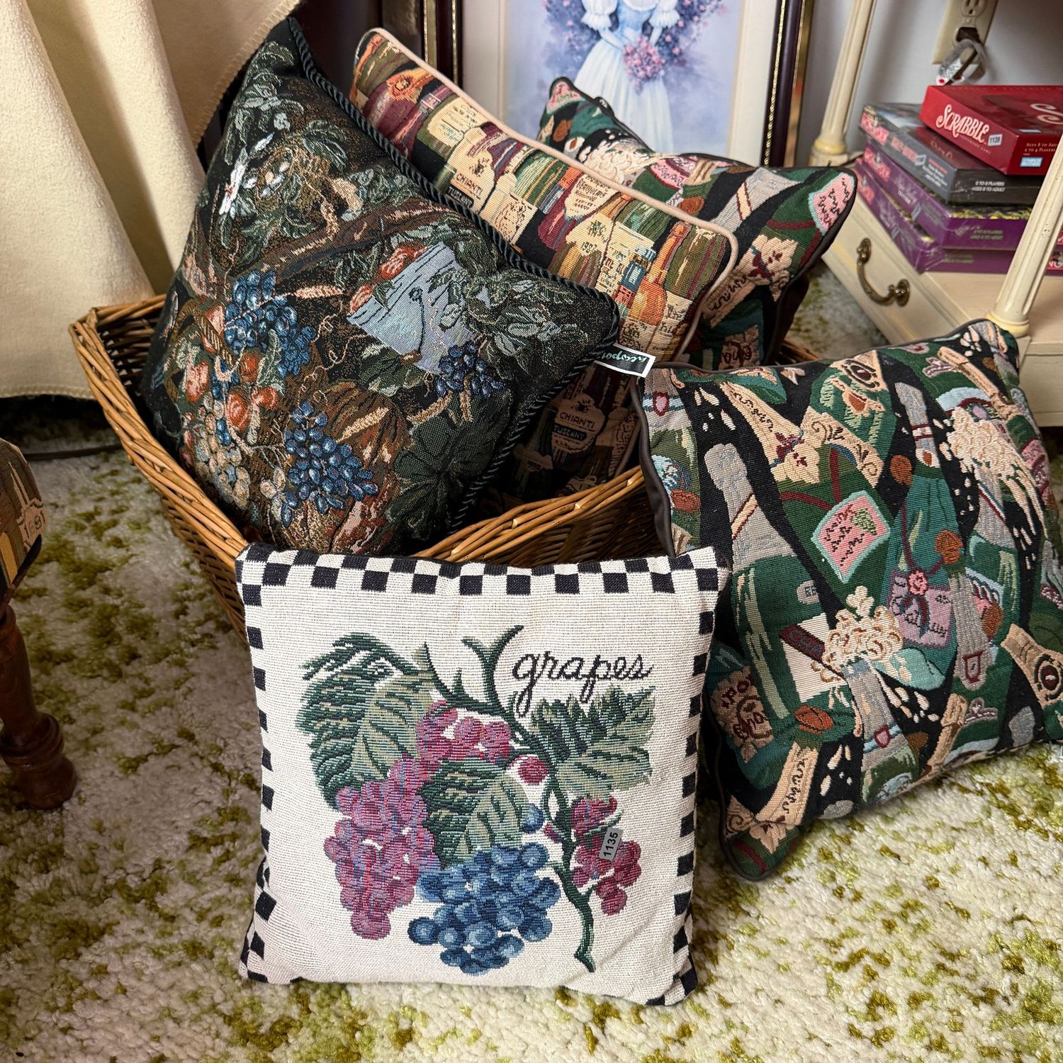 Large wicker basket filled with decorative wine-themed throw pillows 12-14 Large wicker basket filled with decorative wine-themed throw pillows 12-14", S1135