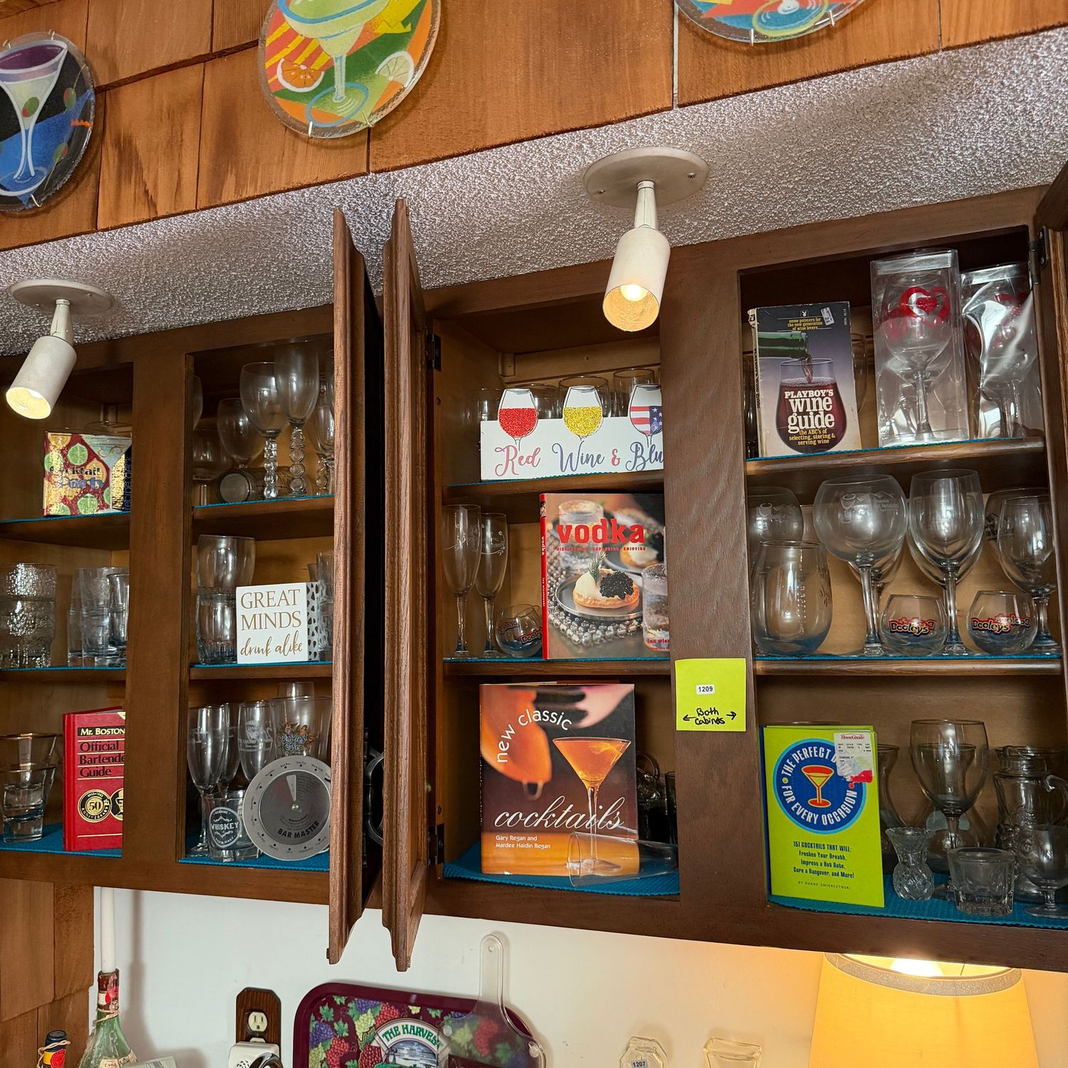 Two cabinets filled with a variety of stemware and bar books, S1209 Two cabinets filled with a variety of stemware and bar books, S1209