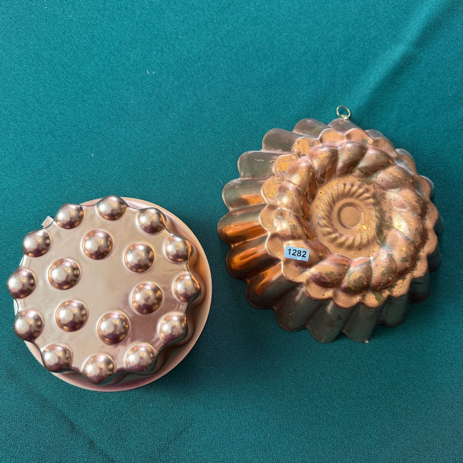 Two round jello molds, one missing hanging loop, the largest is 8 Two round jello molds, one missing hanging loop, the largest is 8"W, S1282