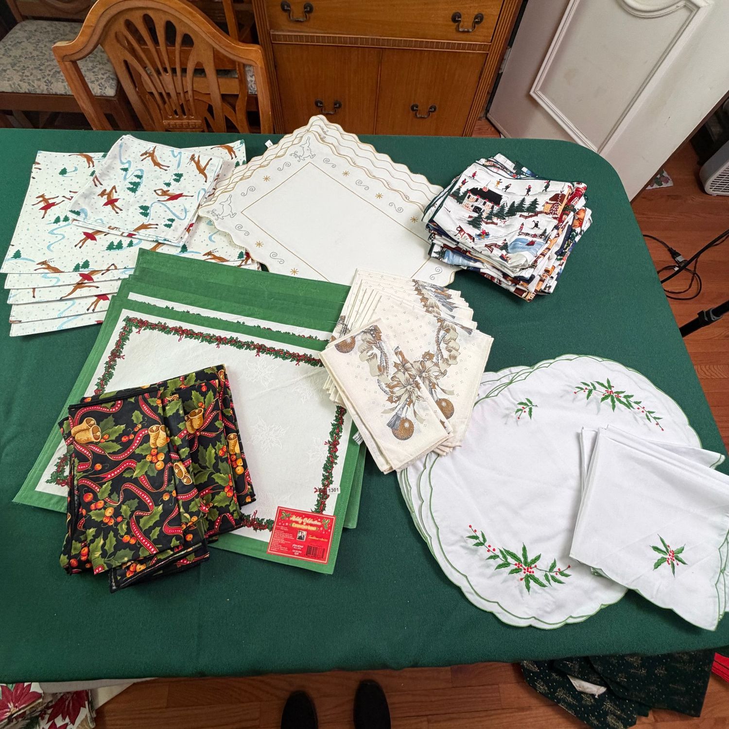Group of Christmas placemats, napkins, reindeer, holly, snowy village scenes, S1301 Group of Christmas placemats, napkins, reindeer, holly, snowy village scenes, S1301