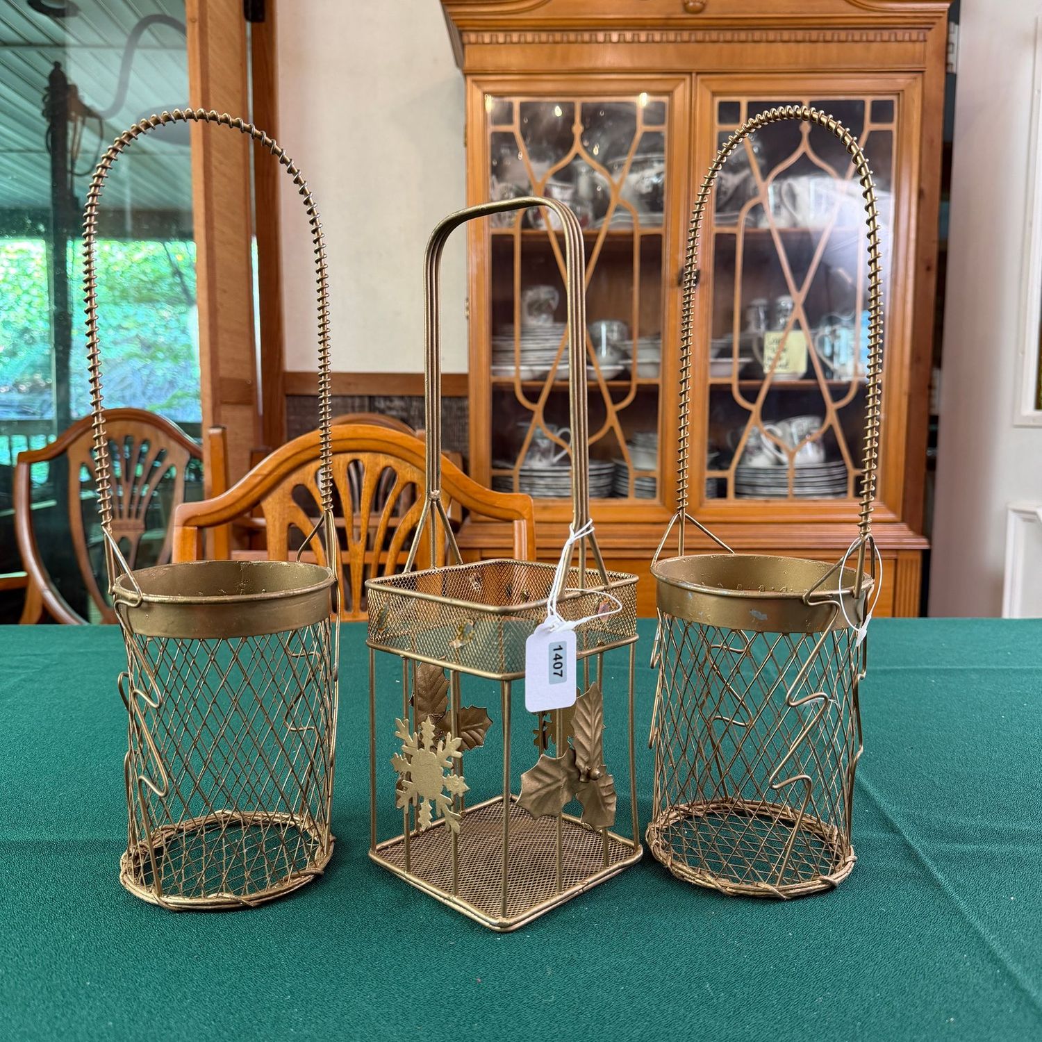 Trio of gold wire wine bottle baskets, S1407 Trio of gold wire wine bottle baskets, S1407