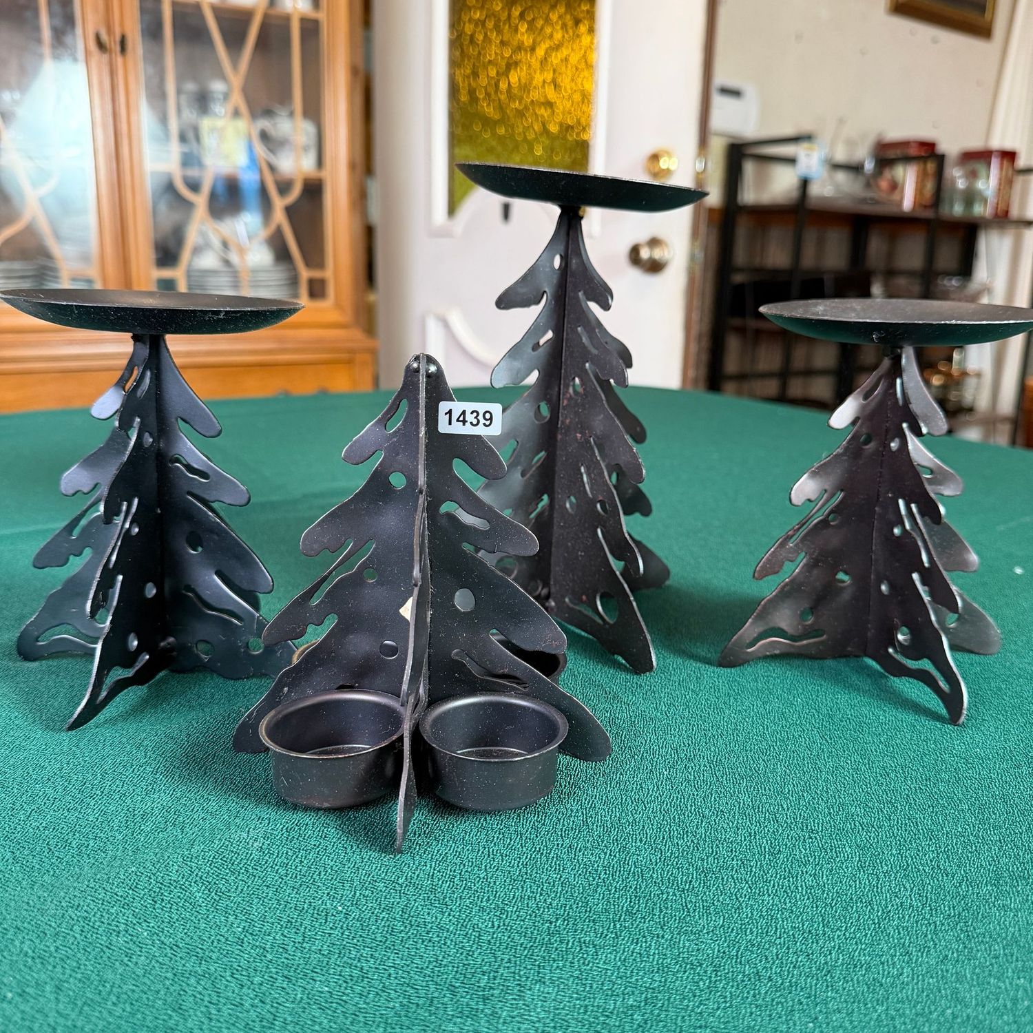 Four black metal candle holders, the tallest is 7 Four black metal candle holders, the tallest is 7", S1439