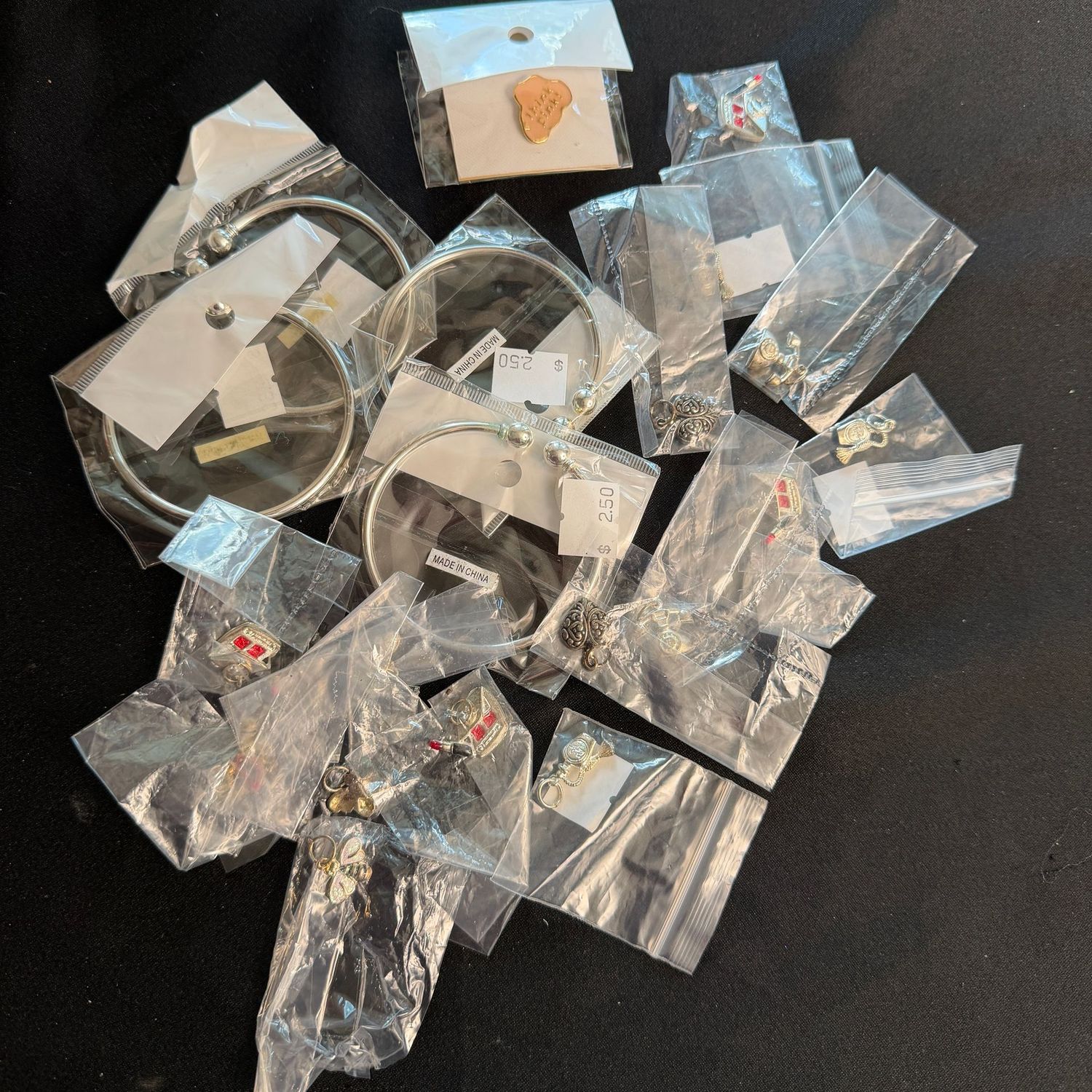 Jewelry Lot R0235 group of packaged cuff bracelets and charms Jewelry Lot R0235 group of packaged cuff bracelets and charms