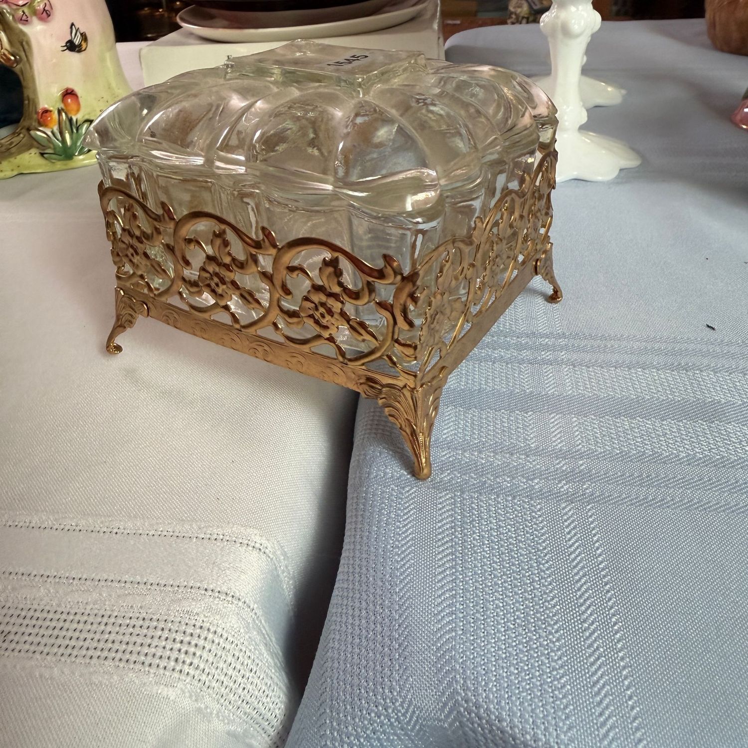 Clear glass trinket dish with gold-tone floral stand, 4 Clear glass trinket dish with gold-tone floral stand, 4"L, S1545