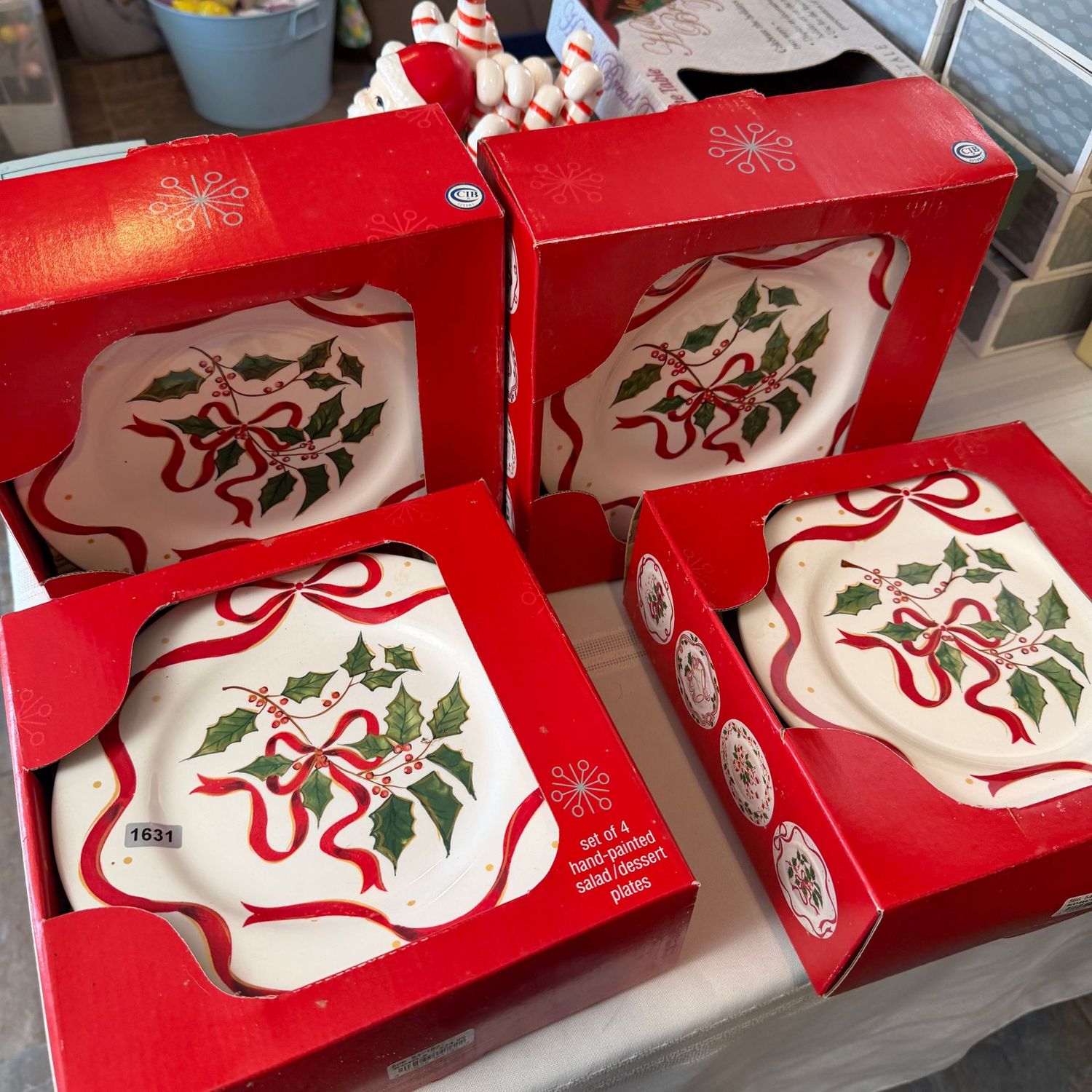 Four boxes of 4 (16 total) hand-painted Christmas dessert/salad plates, four different designs, S1631 Four boxes of 4 (16 total) hand-painted Christmas dessert/salad plates, four different designs, S1631