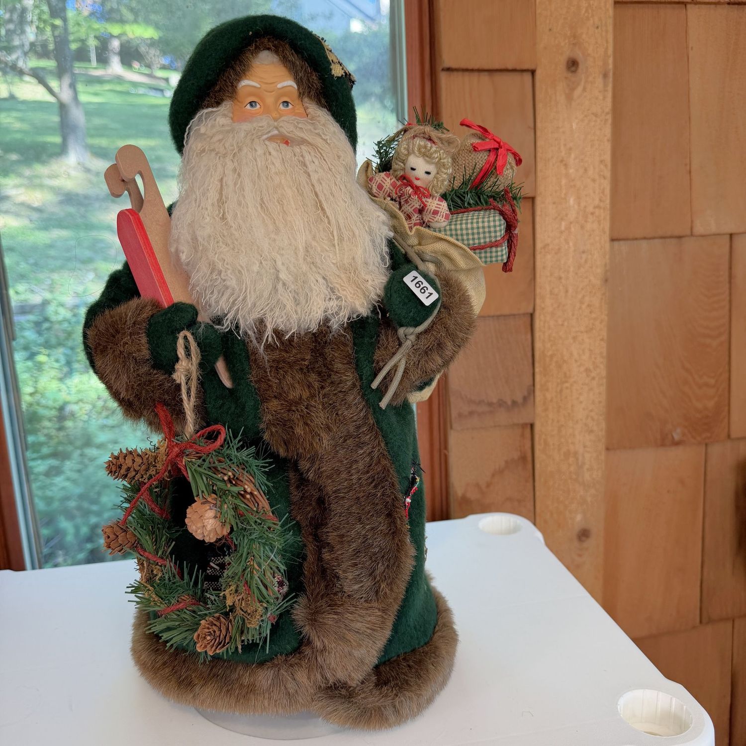 Rustic Santa in green outfit with sled and gifts, cone form, 16 Rustic Santa in green outfit with sled and gifts, cone form, 16"H, S1661