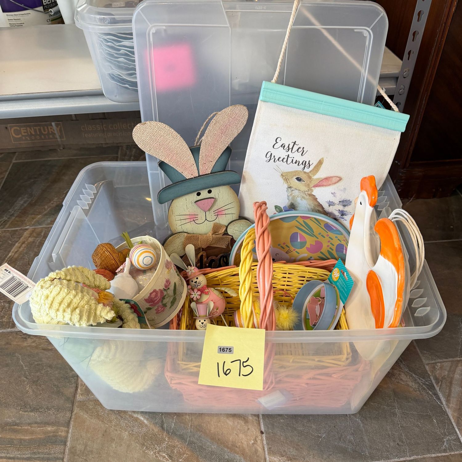 Clear tote filled with Easter decor with easter signs, baskets & more, S1675