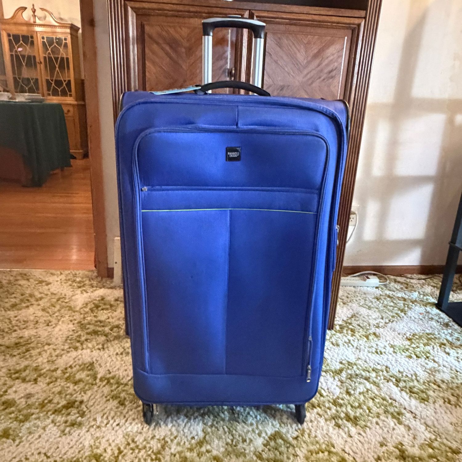 Large bright blue Sharper Image lightweight suitcase with 360 wheels, some wear mostly to the exterior, 29 Large bright blue Sharper Image lightweight suitcase with 360 wheels, some wear mostly to the exterior, 29" x 19", S1702