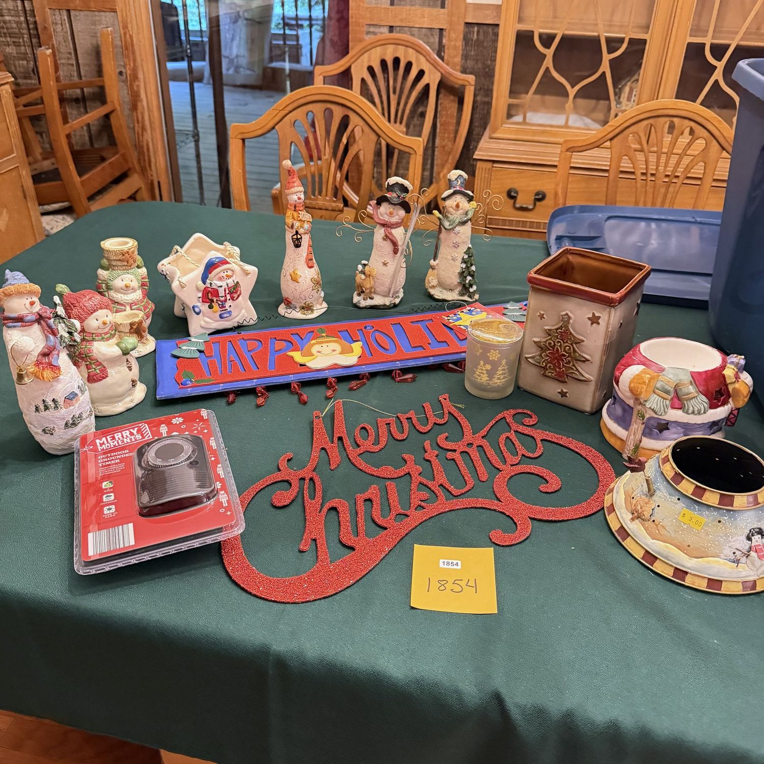 Big blue bin filled with Christmas decorations, snowmen, holiday signs, light timer, S1854