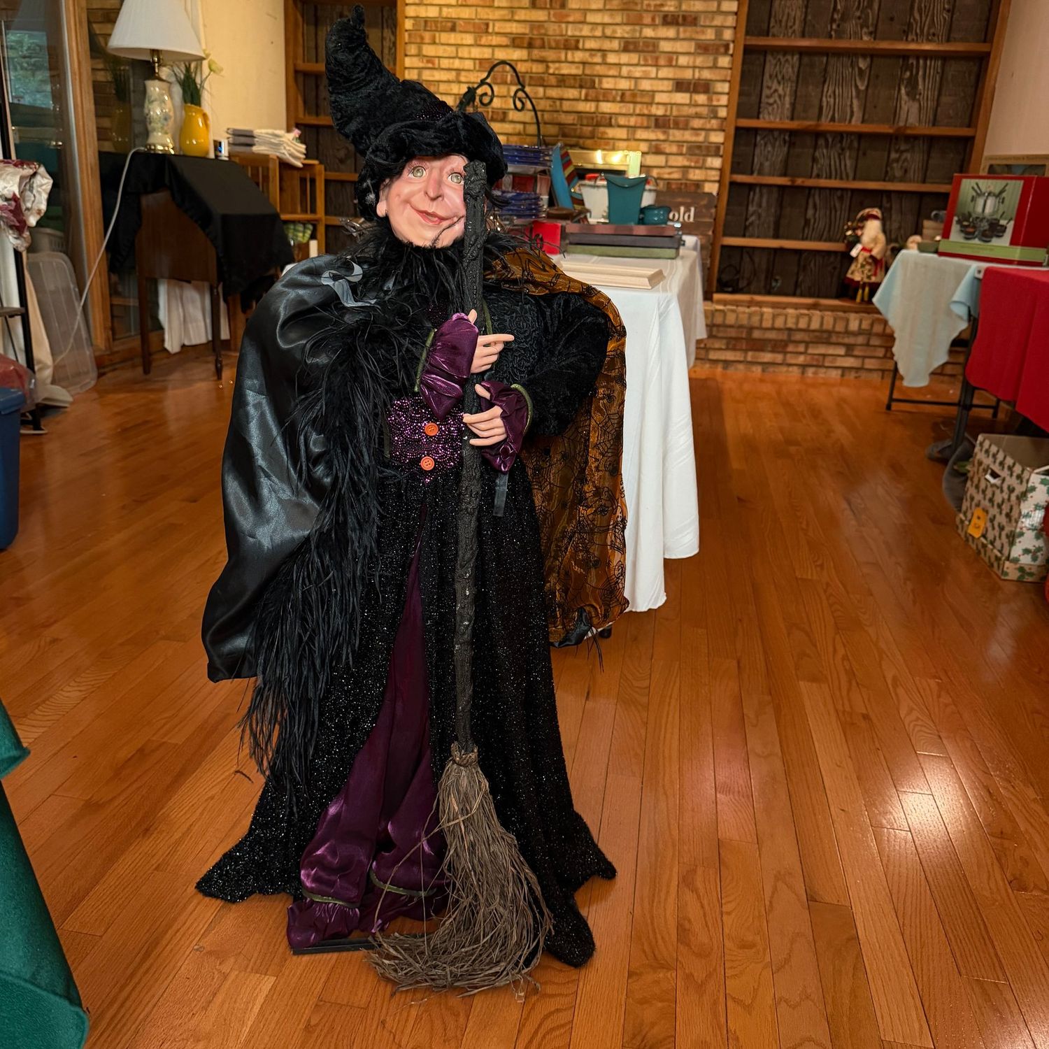 Greet Halloween with this 38 Greet Halloween with this 38"H Happy Witch. She sits on an iron base, with an elaborate costume, and is heavy.