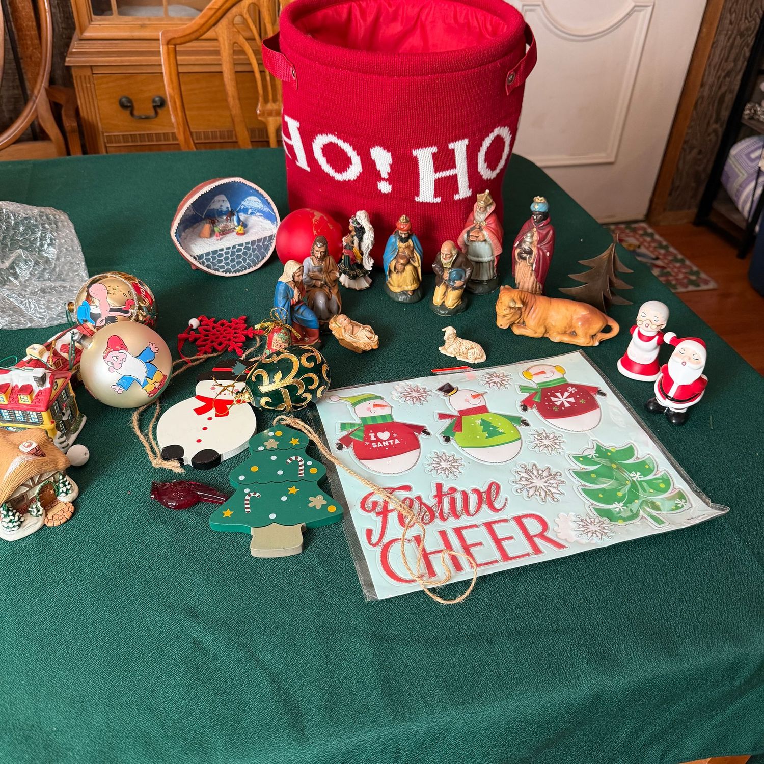 Knit red bin filled with Christmas decorations, vintage nativity (some wear), ornaments, S1861