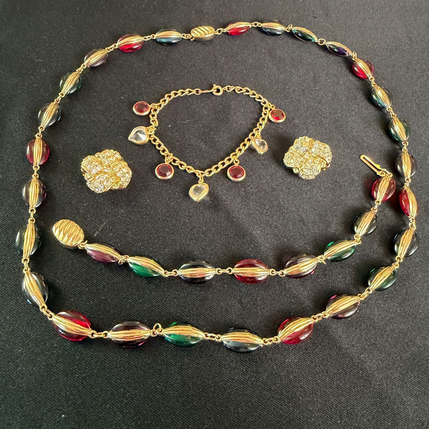 Jewelry Lot R0278 Collection of Swarovski bracelet, crystal clip earrings, and matching jewel-tone bracelet and necklace set Jewelry Lot R0278 Collection of Swarovski bracelet, crystal clip earrings, and matching jewel-tone bracelet and necklace set