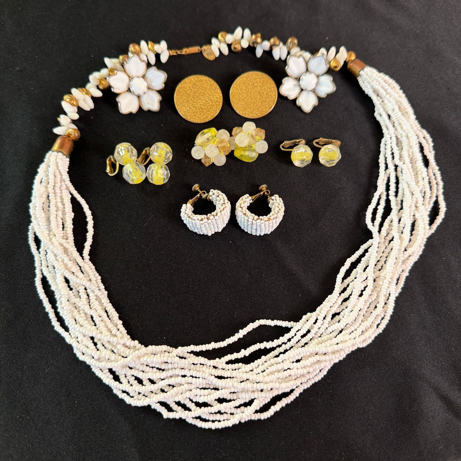Jewelry Lot R0281 Vintage yellow cat-eye and cluster earrings, Miriam Haskel white beaded earrings and matching multi-strand necklace Jewelry Lot R0281 Vintage yellow cat-eye and cluster earrings, Miriam Haskel white beaded earrings and matching multi-strand necklace