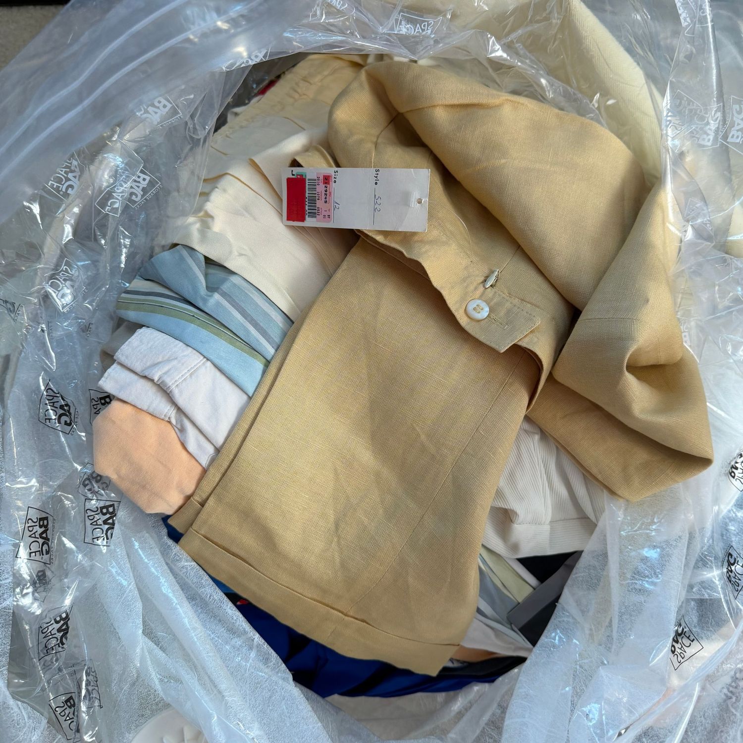 Large mystery bag filled with women's pants and slacks, most are with tags and size 12, mostly summer and lightweight styles, more than 20 pair