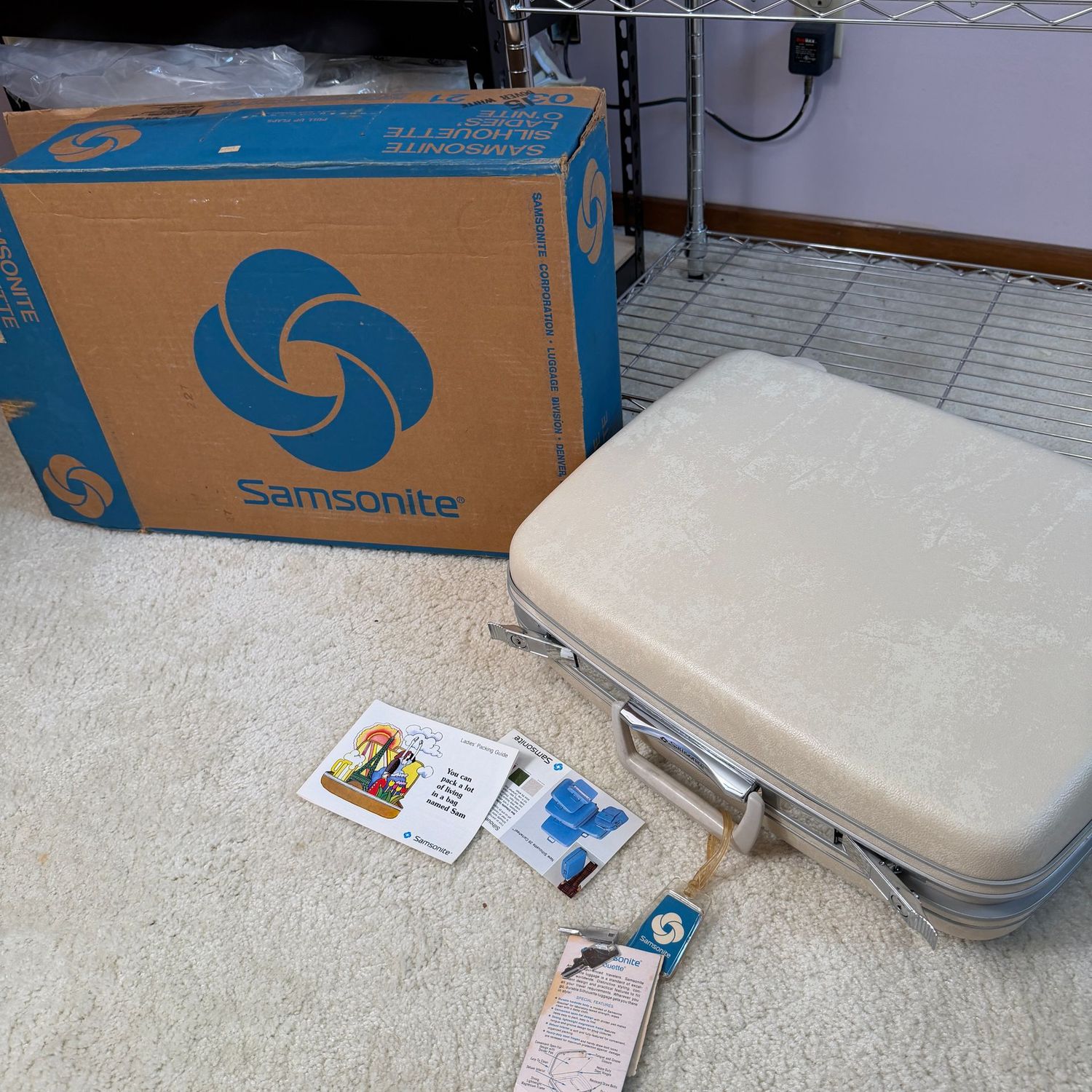 Samsonite ivory Ladies' Silhouette hardcover suitcase with keys, appears unused, 19 Samsonite ivory Ladies' Silhouette hardcover suitcase with keys, appears unused, 19"W