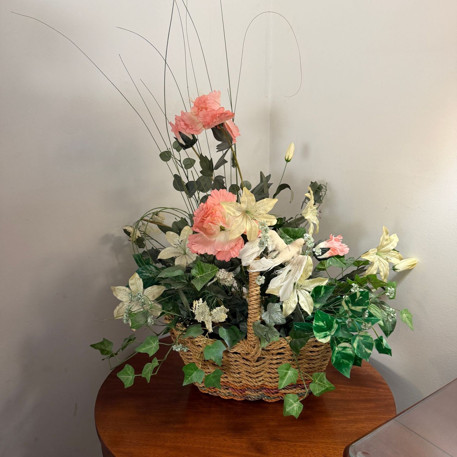 Large rope basket with vining floral arrangement, approx. 30"H x 20"W