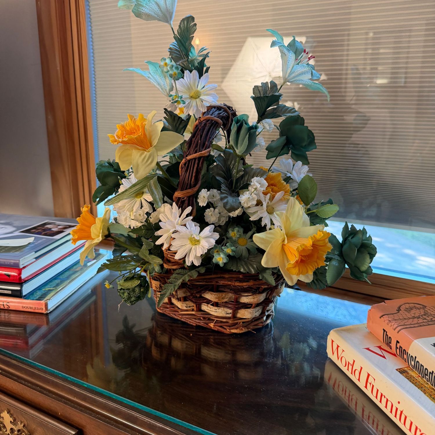 Bark and vine basket with buttercup and daisy floral arrangement, 13"H