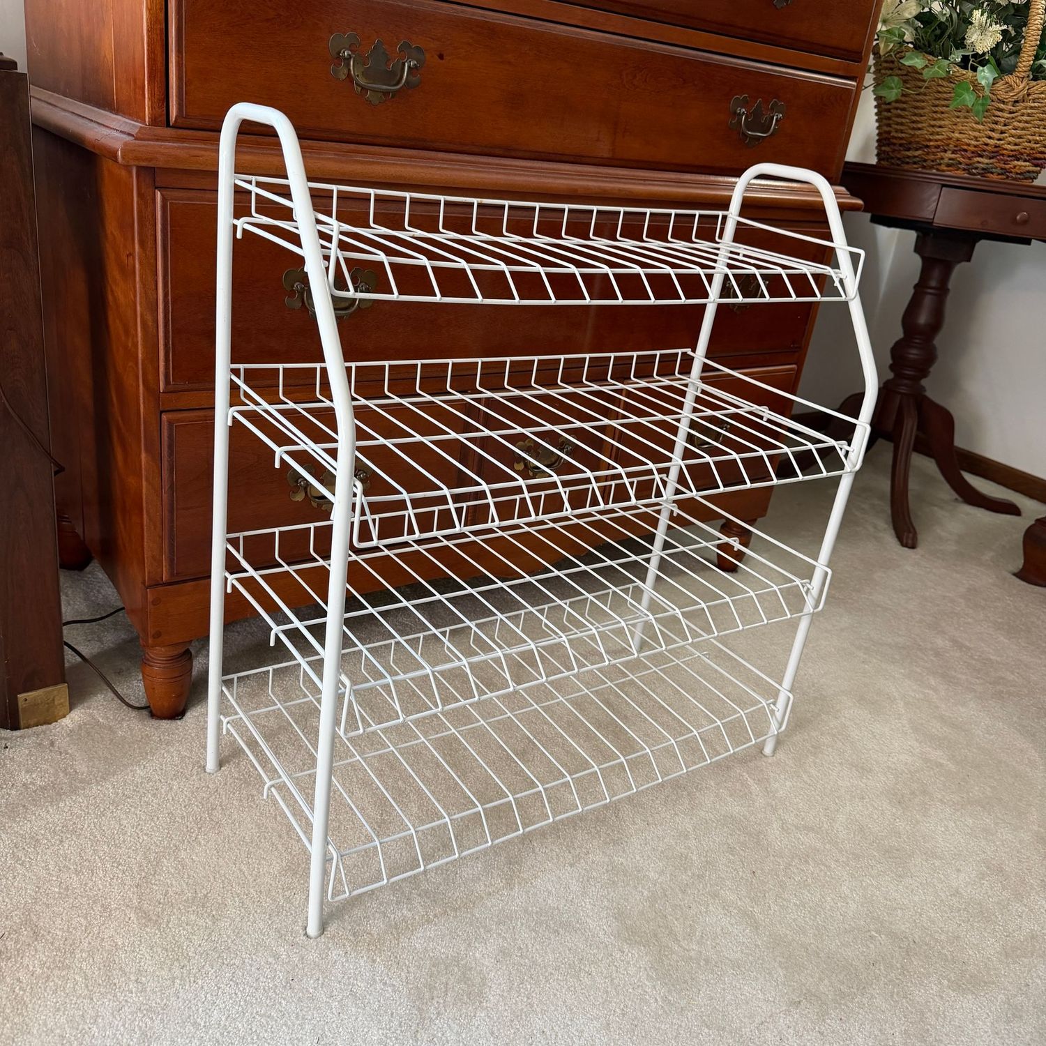 White tubular metal and wire shoe shelf, 25 White tubular metal and wire shoe shelf, 25"W x 25"H x 12"D