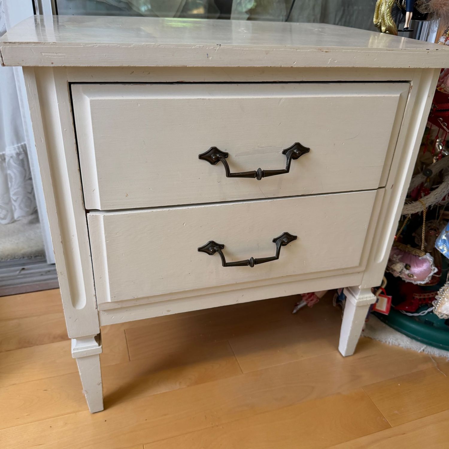 Ivory wooden 2-drawer side table, some wear, 22 Ivory wooden 2-drawer side table, some wear, 22"H x 14"D x 20"W (This item is upstairs)