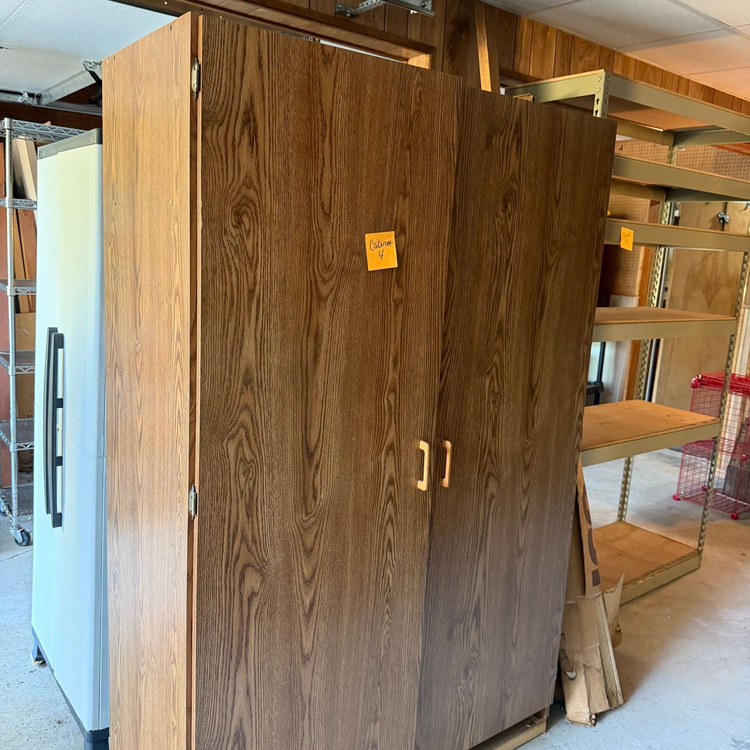Extra large 2-door laminate cabinet (4), has been mounted on 2x4 base for sturdiness, very heavy, easy to load to driveway, 6ft. H x 4 ft. W x 19 in. W Extra large 2-door laminate cabinet (4), has been mounted on 2x4 base for sturdiness, very heavy, easy to load to driveway, 6ft. H x 4 ft. W x 19 in. W
