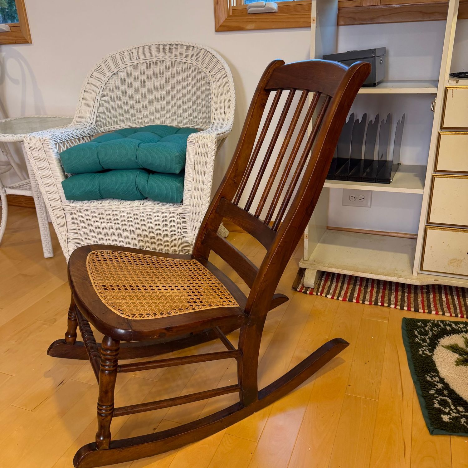 Sewing-size rocker with cane seat, 36 Sewing-size rocker with cane seat, 36"H x 24"W (This item is upstairs)