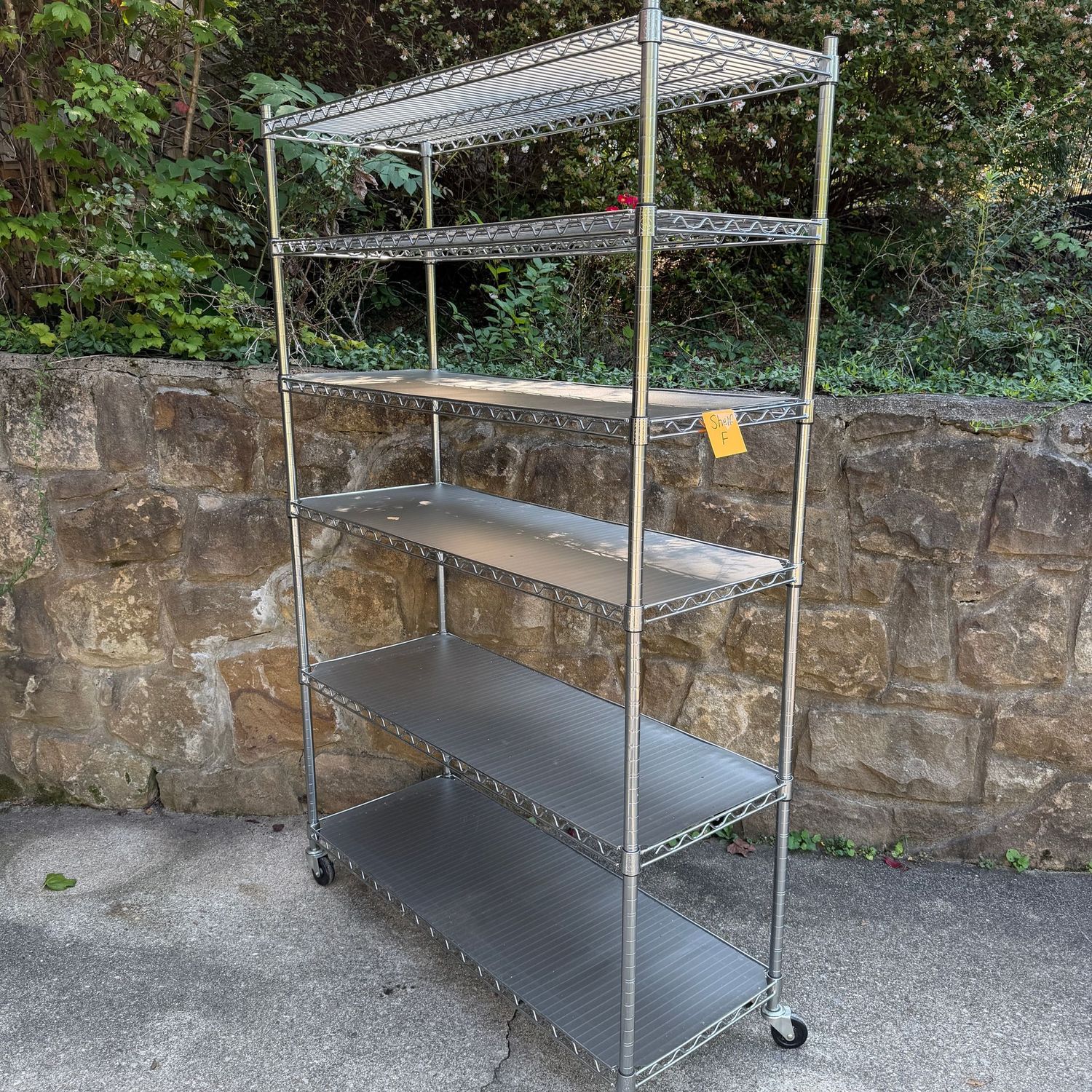Shelf (F) chrome, minor wear, with shelf liners, on casters, 6 shelves, 6'3 Shelf (F) chrome, minor wear, with shelf liners, on casters, 6 shelves, 6'3" x 18" x 36"