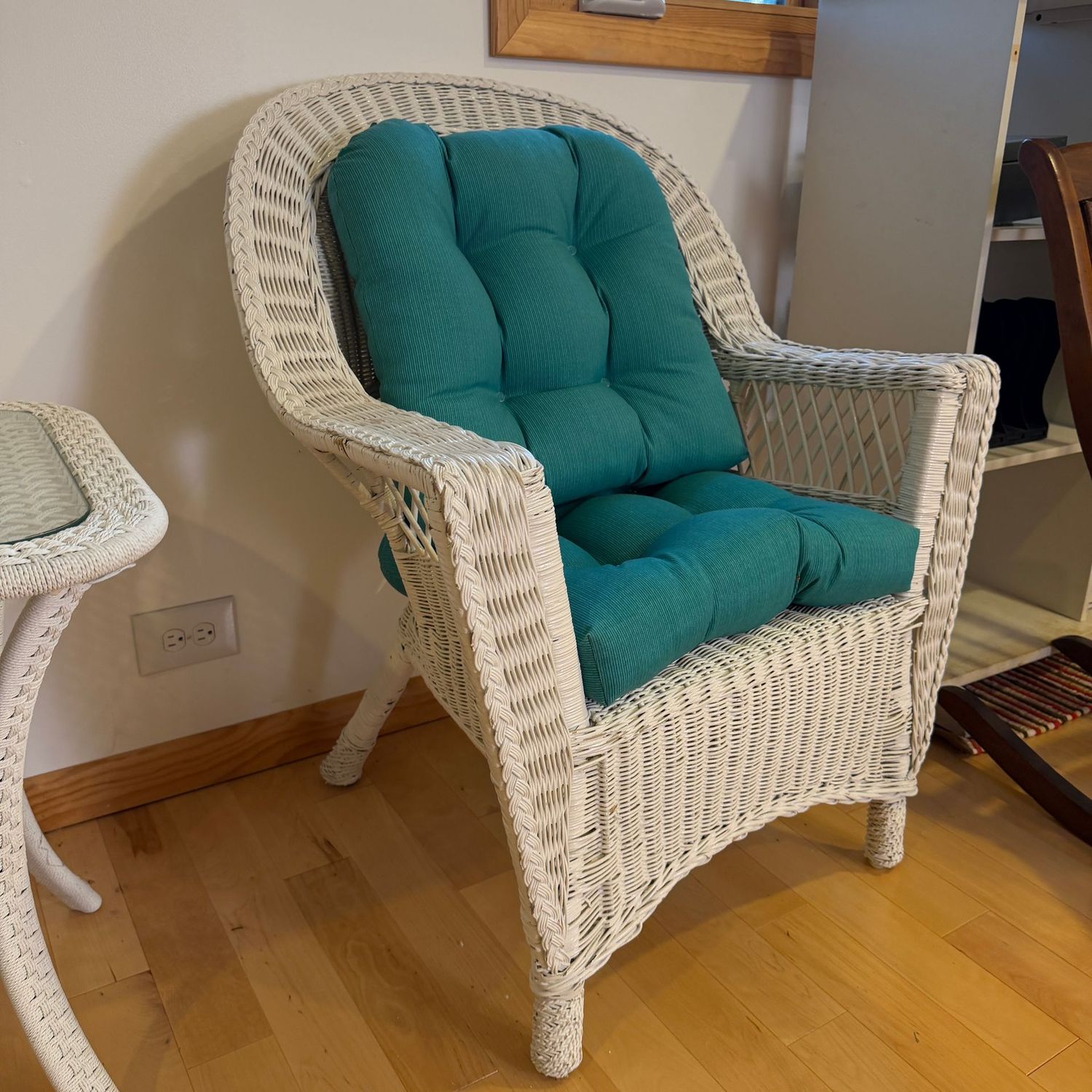White wicker armchair with teal cushions (not fitted) overall, the chair is in very nice condition with minimal wear (Item is upstairs) 35 White wicker armchair with teal cushions (not fitted) overall, the chair is in very nice condition with minimal wear (Item is upstairs) 35"H x 29"W