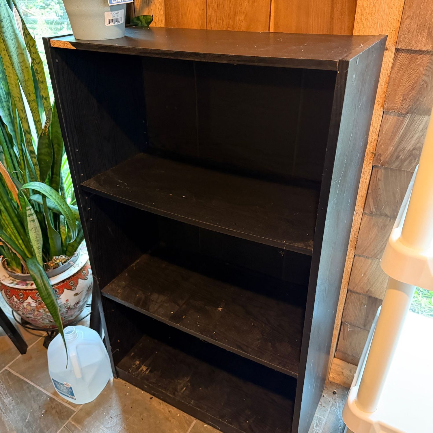 Black laminate bookshelf, some wear to laminate, some mild bowing to shelves, still very sturdy & useful, 44 Black laminate bookshelf, some wear to laminate, some mild bowing to shelves, still very sturdy & useful, 44"H x 24"W x 11"D