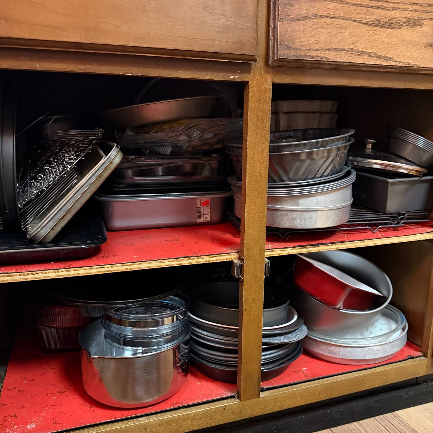 Cupboard H - large and deep cupboard filled with a super metal and glass baking pan selection, sheet, pie, bundt, cupcake, loaf, cooling racks Cupboard H - large and deep cupboard filled with a super metal and glass baking pan selection, sheet, pie, bundt, cupcake, loaf, cooling racks