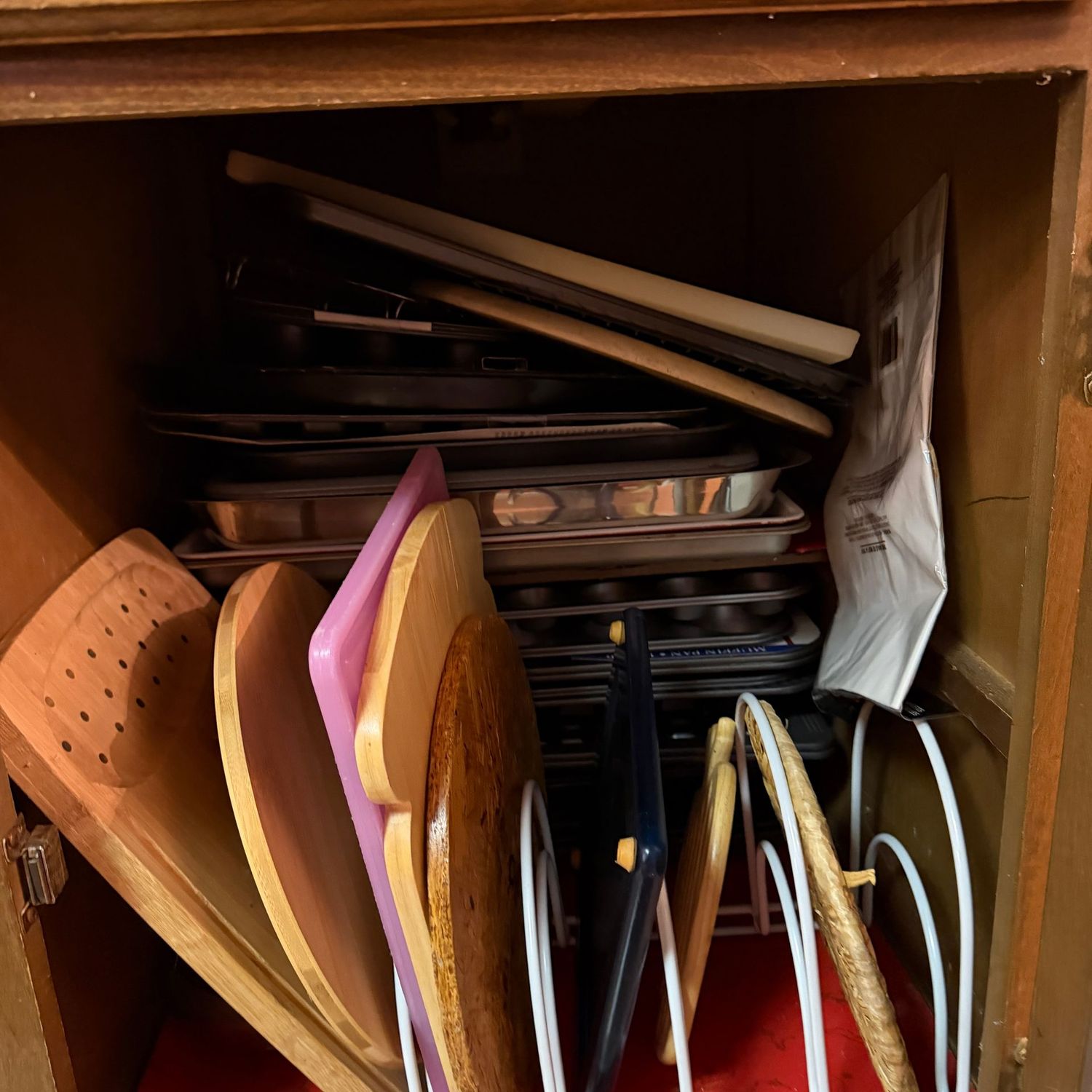 Cupboard B - Deep cupboard filled with cutting boards, and a large variety of baking sheet pans, cupcake pans Cupboard B - Deep cupboard filled with cutting boards, and a large variety of baking sheet pans, cupcake pans