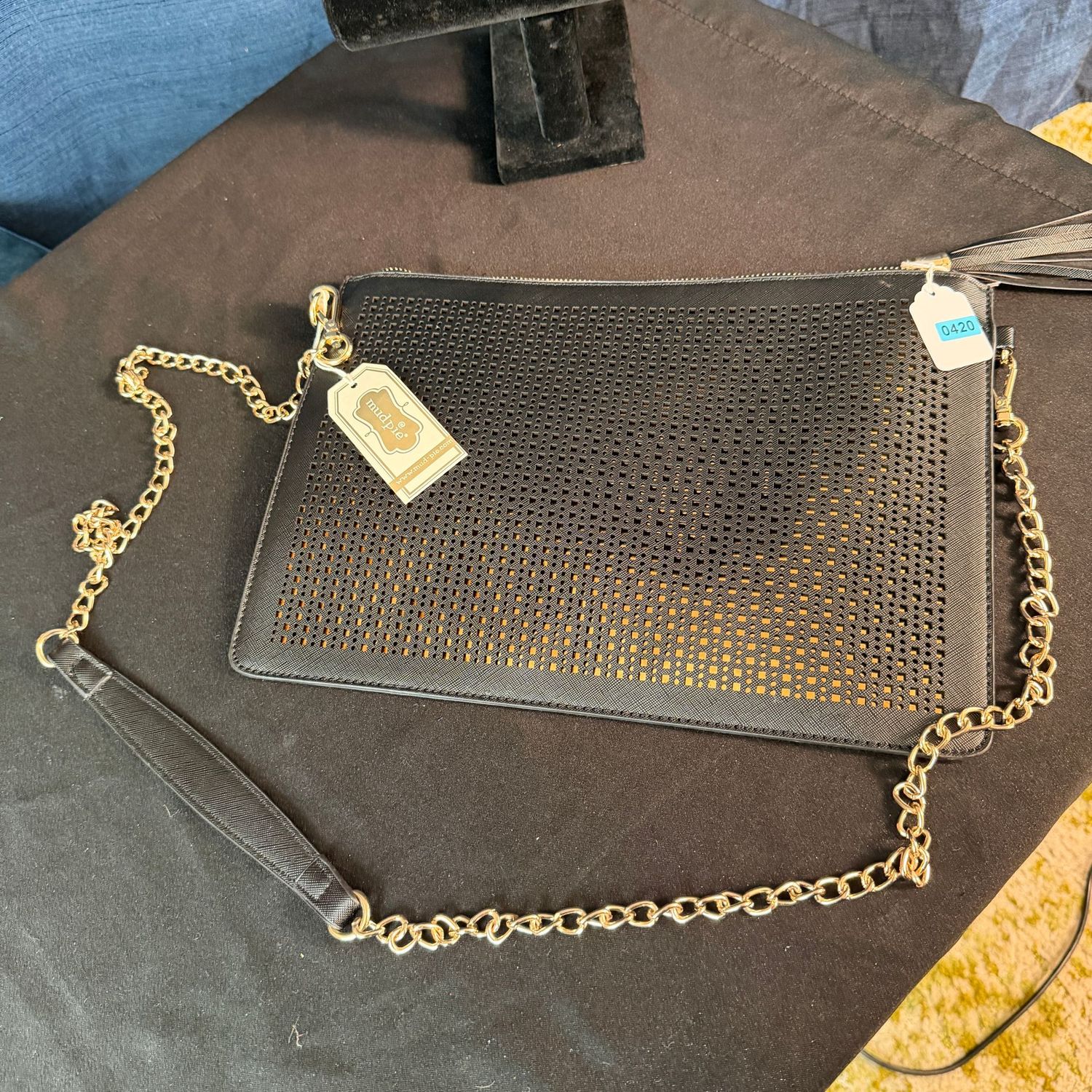 Mudpie black pierced vinyl purse with gold underlayment, slender profile, 13"W, B0420