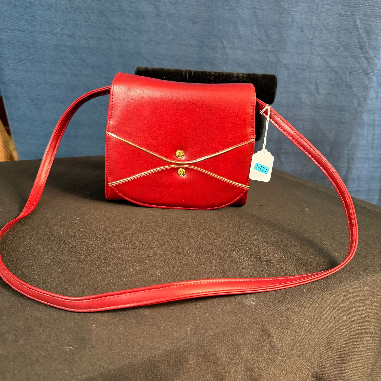Red vinyl purse with gold piping, black liner, 8 Red vinyl purse with gold piping, black liner, 8"L, B0431